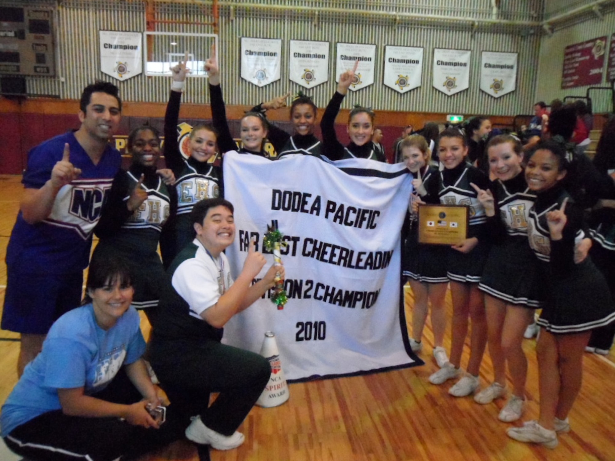 Members of Robert D. Edgren High School's cheerleading team reclaim the Far East High School Cheerleading Competition Division II title at the Far East Cheer Camp, Nov. 12, 2010, at Matthew C. Perry High School, Marine Corps Air Station Iwakuni, Japan. With the exception of last year, Edgren has been named the Far East Small Schools Champions three times in the last four years. (Photo courtesy of Dr. Leah Sledge)
