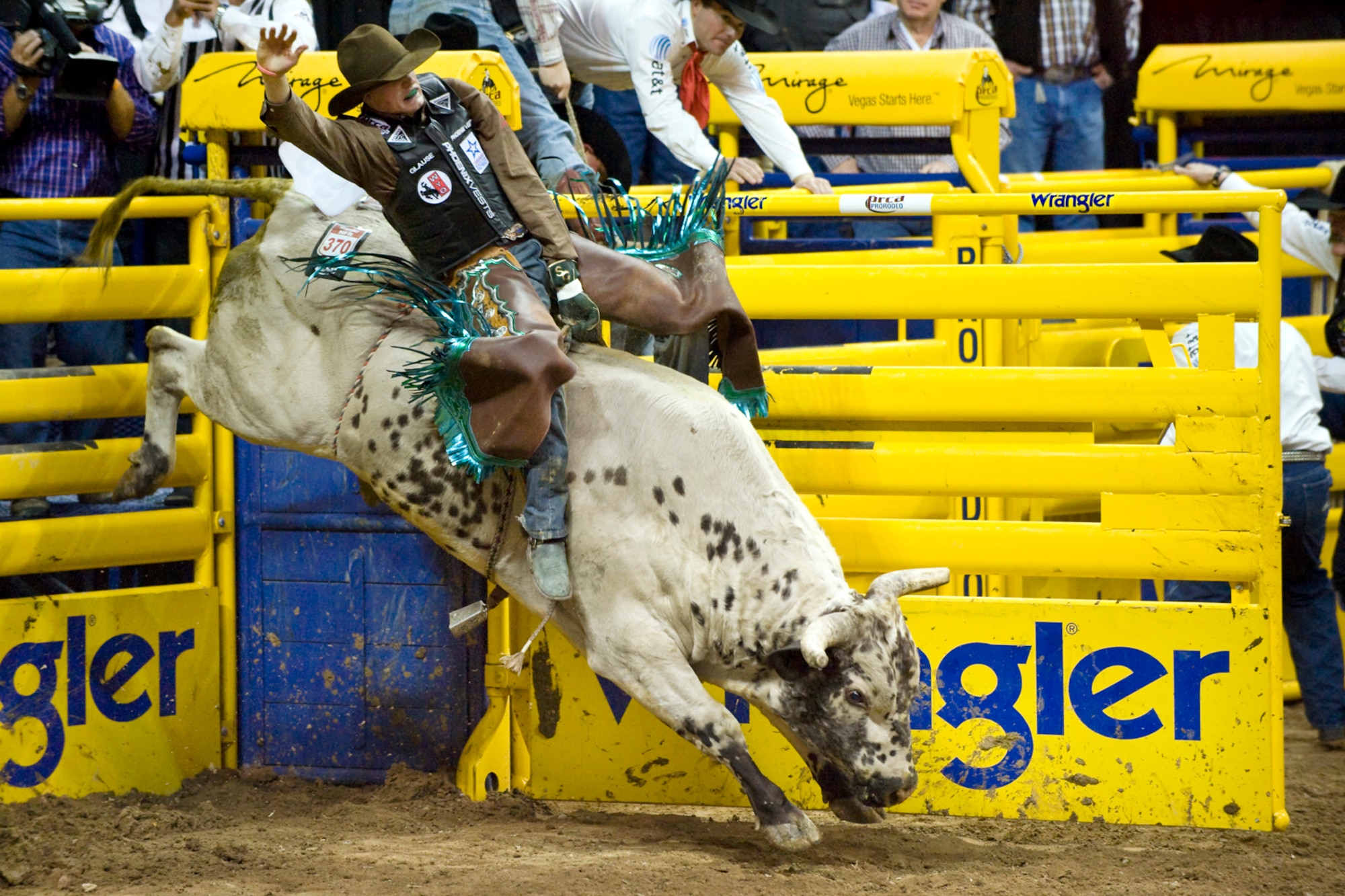 LAS VEGAS-- Bull rider Seth Glause from Rock Springs, Wyo., rides Texas Sancho during the fourth round of the National Finals Rodeo at the Thomas and Mack Center Dec. 5. (U.S. Air Force photo by Lawrence Crespo/Released) 