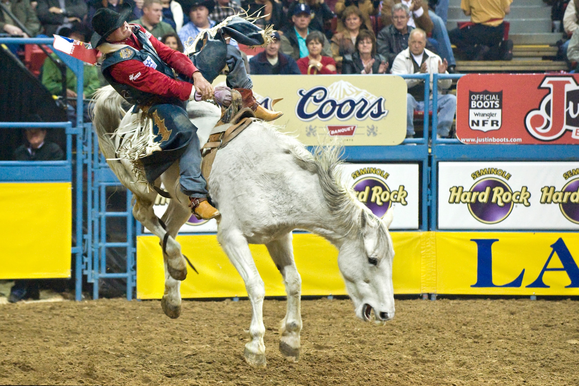 LAS VEGAS-- Clint Cannon, from Waller, Texas, rides Peaches and Cream to an 86.5 second place finish during the bareback competition in the fourth round of the National Finals Rodeo at the Thomas and Mack Center Dec. 5. The NFR paid tribute to the men and women of the armed forces for their service to our country. (U.S. Air Force photo by Lawrence Crespo/Released) 