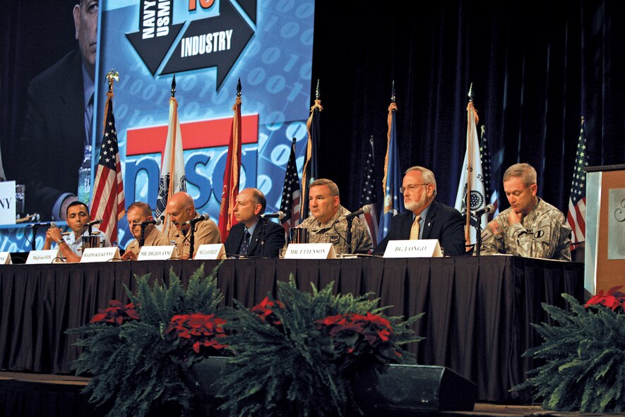 Rear Adm. Joseph Kilkenny presents his views on how industry can support Navy training and simulation requirements during a panel discussion by senior Department of Defense and service leaders Nov. 30, at the Interservice/Interagency Training Simulation & Education Conference in Orlando, Fla. Each presented their perspectives on the need to anticipate service modeling & simulation requirements to ready for the full spectrum of potential threats future joint warfighters may face.  Admiral Kilkenny is commander, Naval Education and Training command.  Also pictured are (from left): Rear Adm. Vincent Atkins, assistant commandant for Capability, U.S. Coast Guard; Maj. Gen. Raymond Fox, commanding general, Training and Education Command, U.S. Marine Corps, Mr. Frank DiGiovanni, director, Readiness and Training Policy and Programs, Office of the Deputy Undersecretary of Defense (Readiness);  Maj. Gen. Stephen Layfield, director, Joint Warfighting Center, Joint Forces Command; Mr. Gordon Ettenson, director, Irregular Warfare, Operational Capability Requirements,  Directorate of Operations, Headquarters U.S. Air Force; and Brig. Gen. Richard Longo, deputy chief of staff, Training and Doctrine command, U.S. Army. (Photo Courtesy NSTA) 