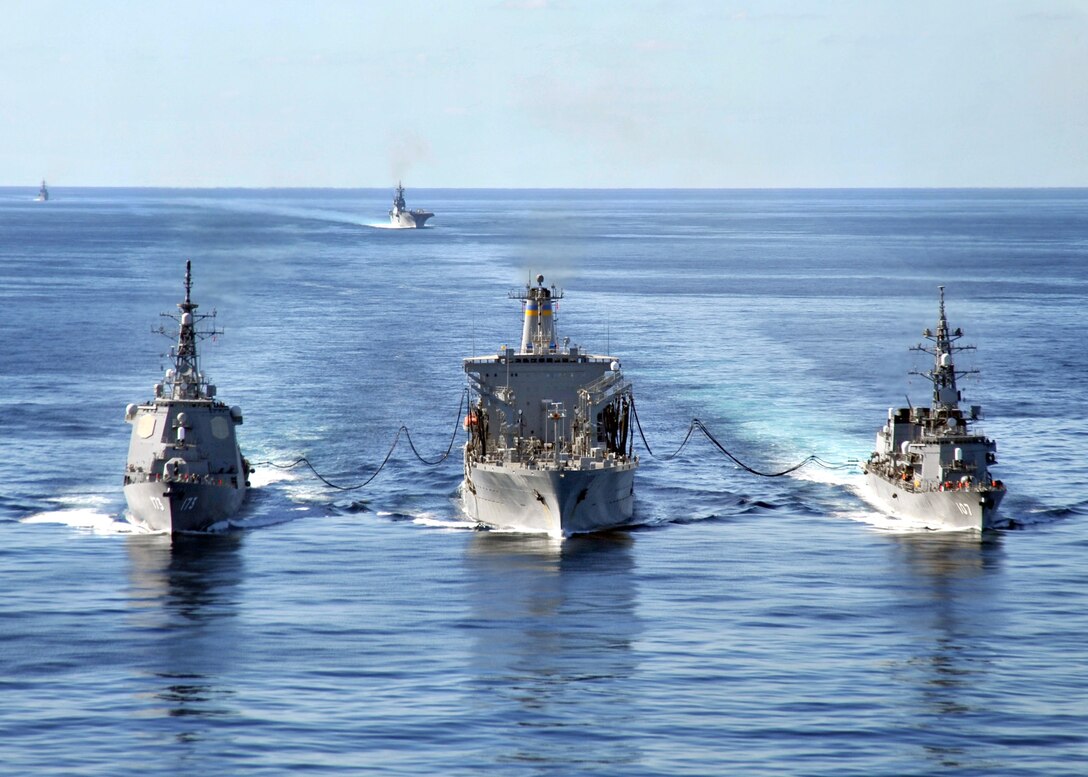 USNS Tippecanoe, center, refuels two Japan Maritime Self Defense Force Escort Flotilla ships in the East China Sea, Dec. 5, 2010. The ships are participating in Keen Sword 2011, a bilateral exercise between the U.S. and Japanese navies. 