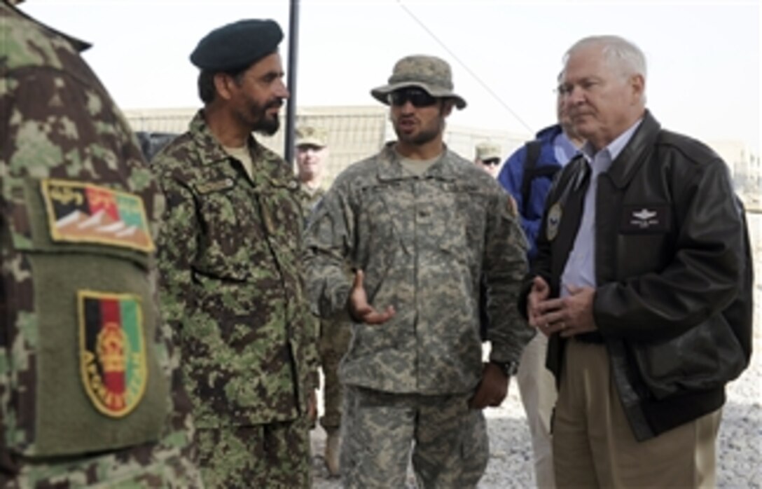 Secretary of Defense Robert M. Gates talks with Afghanistan National Army soldiers at Forward Operating Base Howz-e-Madad, Afghanistan, on Dec. 8, 2010.  