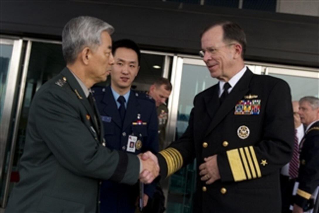 Chairman of the Joint Chiefs of Staff Adm. Mike Mullen, U.S. Navy, thanks Chairman of the South Korean Joint Chiefs of Staff Gen. Han Min-koo after bi-lateral meetings in Seoul, Republic of South Korea, on Dec. 8, 2010.  Mullen traveled to Korea to meet with defense officials there reassuring the strength of the U.S.-South Korean alliance in light of recent tensions with the north.  