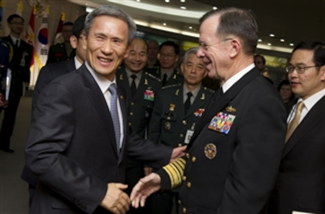 Chairman of the Joint Chiefs of Staff Adm. Mike Mullen, U.S. Navy, is greeted by South Korean Minister of Defense Kim Kwan-jin during meetings in Seoul, Republic of South Korea, on Dec. 8, 2010.  Mullen traveled to Korea to meet with defense officials there reassuring the strength of the U.S.-South Korean alliance in light of recent tensions with the north.  