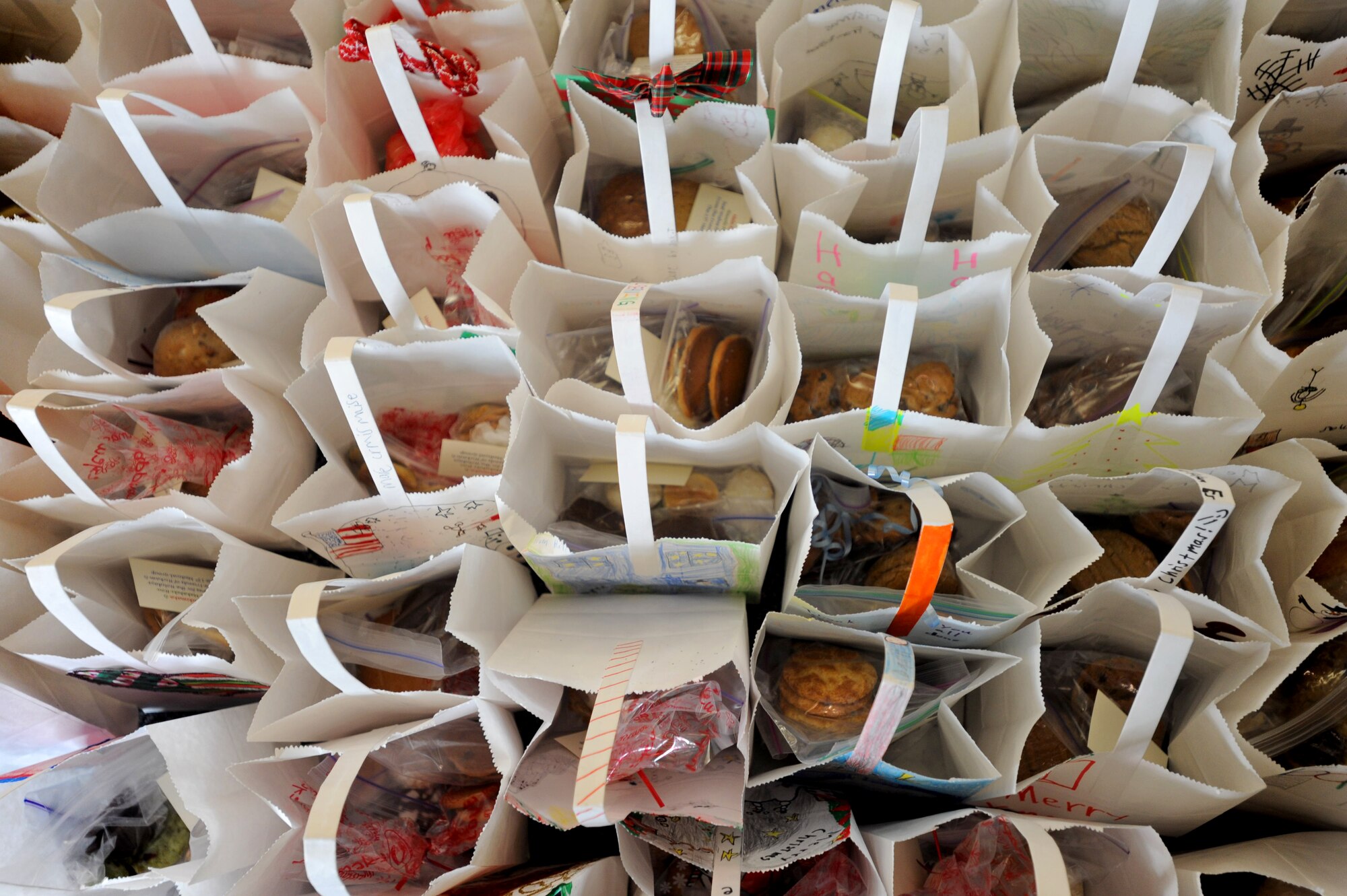 Holiday treats were baked for Airmen and their families as part of the annual Cookie Caper event Dec. 9 at Joint Base Pearl Harbor-Hickam, Hawaii. More than 27,000 cookies were baked and donated to brighten the spirits of Airmen stationed here. (U.S. Air Force Photo/Airman 1st Class Lauren Main)