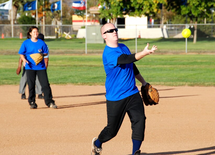 The top players in this year's intramural softball league play aainst one another in the All-Star Game Oct. 27, 2010.  The East team won against the West team with a score of 14-10.  The SSI team beat the Security Forces team in both games of the championship held Oct. 19 and Oct. 26 (continuing with extra innings on Oct. 28).  The scores of the games were 4-3 and 19-18.  Although SSI earned the title of base champions, the Security Forces team was the league champion for the best record during the season.  (U.S. Air Force photos/ Henry Kim)