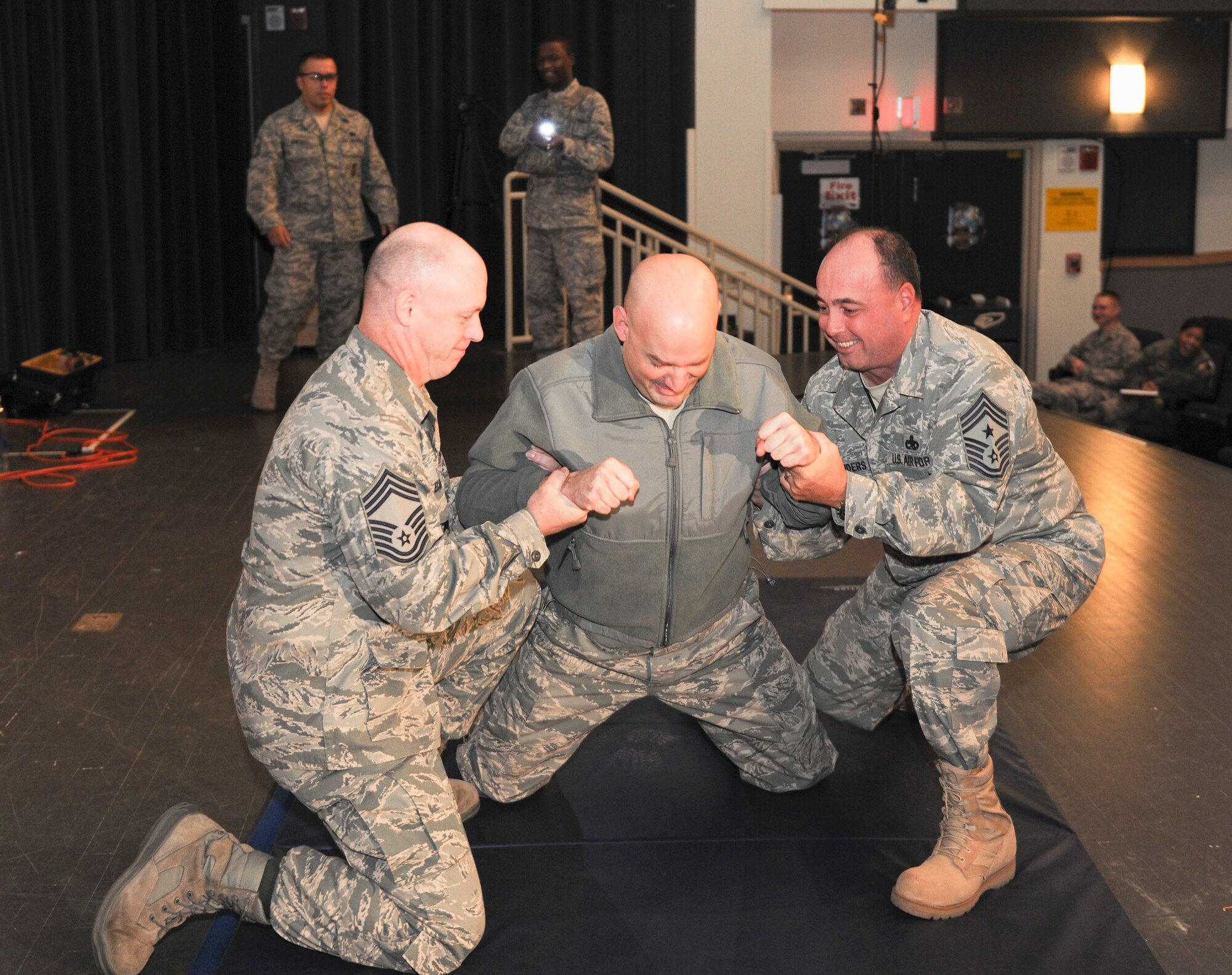 Lt. Col. Mark Anarumo reacts to being shot in the back with a Taser during a demonstration Dec. 7, 2010, at Kunsan Air Base, South Korea. The Taser is the newest non-lethal-force asset option for security forces members to use to contain potentially harmful situations. Colonel Anarumo is the 8th Security Forces Squadron commander. (U.S. Air Force photo/Staff Sgt. Jonathan Pomeroy) 