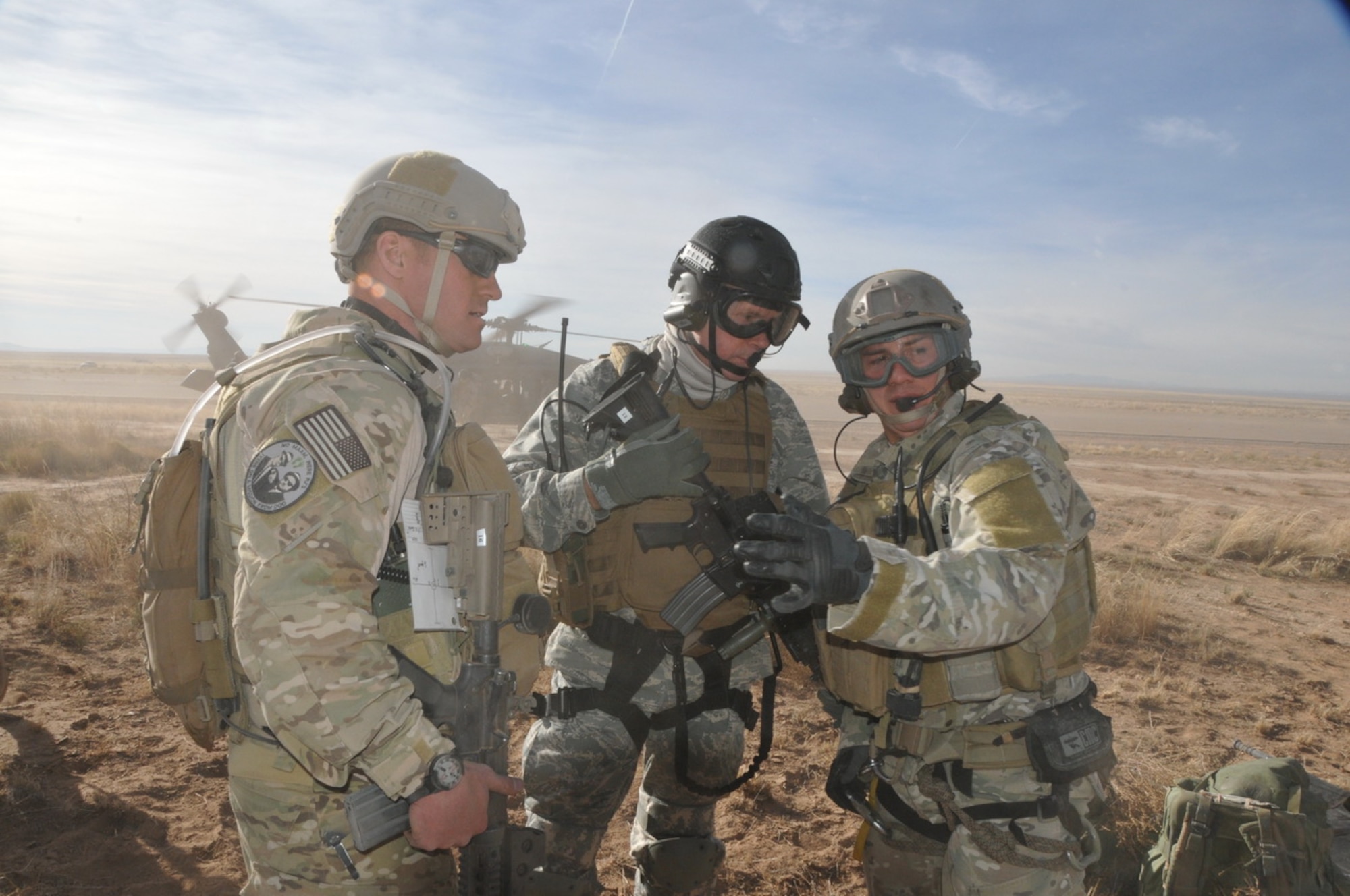 Gen. William M. Fraser III, Commander of Air Combat Command, and two
Airmen from the 342nd Trainings Squadron exit a HH-60G Pave Hawk and discuss
their approach during a mass casualty exercise at Camp Plite, N.M., Dec. 8.
General Fraser visited with combat rescue officers and pararescuemen
during a trip to the PJ Schoolhouse at Kirtland Air Force Base, N.M., as
well as participated in the unit's exercise. (courtesy photo)
