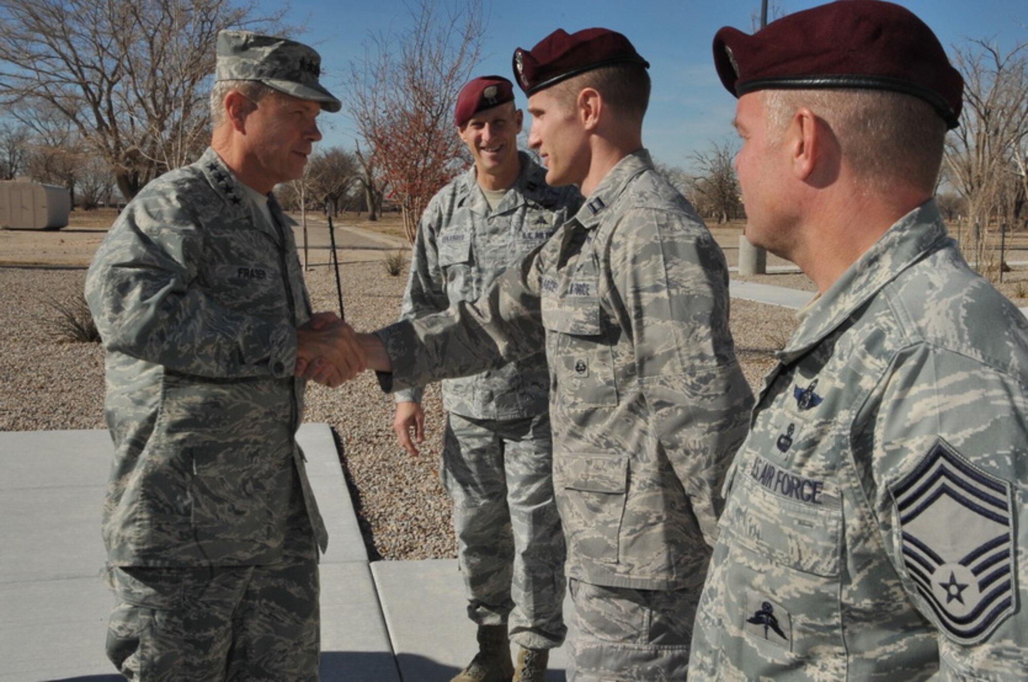 Gen. William M. Fraser III, commander of Air Combat Command, is greeted by
Capt. Ryan Pearce, 342nd Training Squadron combat rescue officer, Capt.
Anthony Alexander, 342nd TRS Det. 1 commander, and Chief Master Sgt. Michael
Fleming, 342nd TRS superintendent, during a visit to Kirtland Air Force
Base, N.M., Dec. 8. (courtesy photo) 
