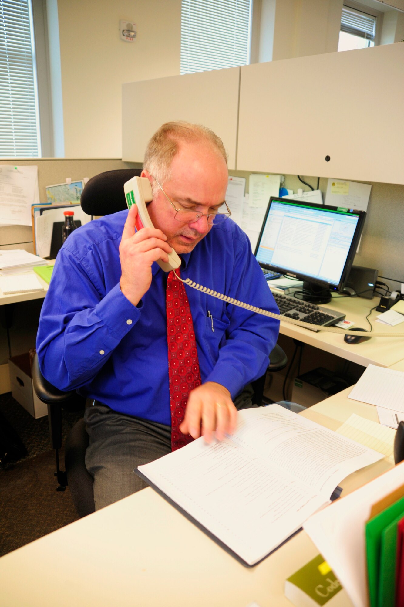 Jerry Killingsworth, 62nd Airlift Wing Civilian Personnel Office human resources specialist, provides guidance to a customer on the telephone Dec. 9 at McChord Field, Joint Base Lewis-McChord, Wash. Air Mobility Command noted the office 2010 Best Civilian Personnel support to base. The office was also voted one of the highest trust levels by employees.   (U.S. Air Force photo/Airman Leah Young)