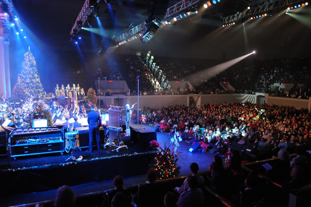 Lt. Col. A. Phillip Waite, commander and conductor of The United States Air Force Band, leads the audience in a sing-a-long of carols as part of the Band's holiday concerts at DAR Constitution Hall. For this year's performances, the Concert Band, Singing Sergeants, and Ceremonial Brass joined forces to offer over 10,000 attendees "The Best Gift of All." (U.S. Air Force photo by Senior Airman Christopher Ruano) 