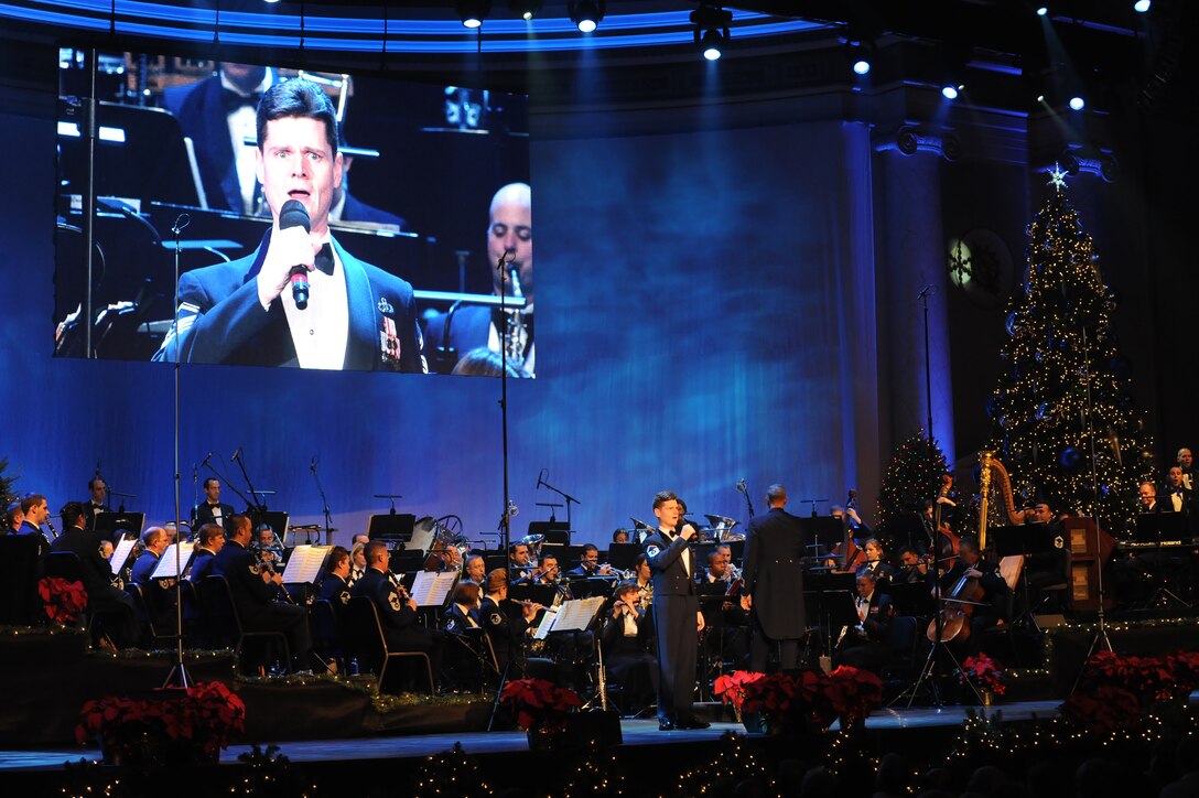 Baritone vocalist Senior Master Sgt. Robert Harrelson performs "Do You Hear What I Hear" as part of The United States Air Force Band's holiday concerts at DAR Constitution Hall. For this year's holiday performances, the Concert Band, Singing Sergeants, and Ceremonial Brass joined forces to offer over 10,000 attendees "The Best Gift of All." (U.S. Air Force photo by Senior Airman Christopher Ruano) 