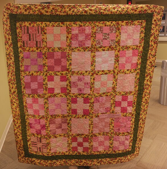MOODY AIR FORCE BASE, Ga. -- As a contribution to the Combined Federal Campaign, a silent auction for two breast cancer awareness quilts is being held at the 23rd Medical Group.The winner will sign a CDC pledge card for the proceeds to go to a breast cancer awareness charity. (U.S. Air Force photo/Airman 1st Class Benjamin Wiseman)(RELEASED)