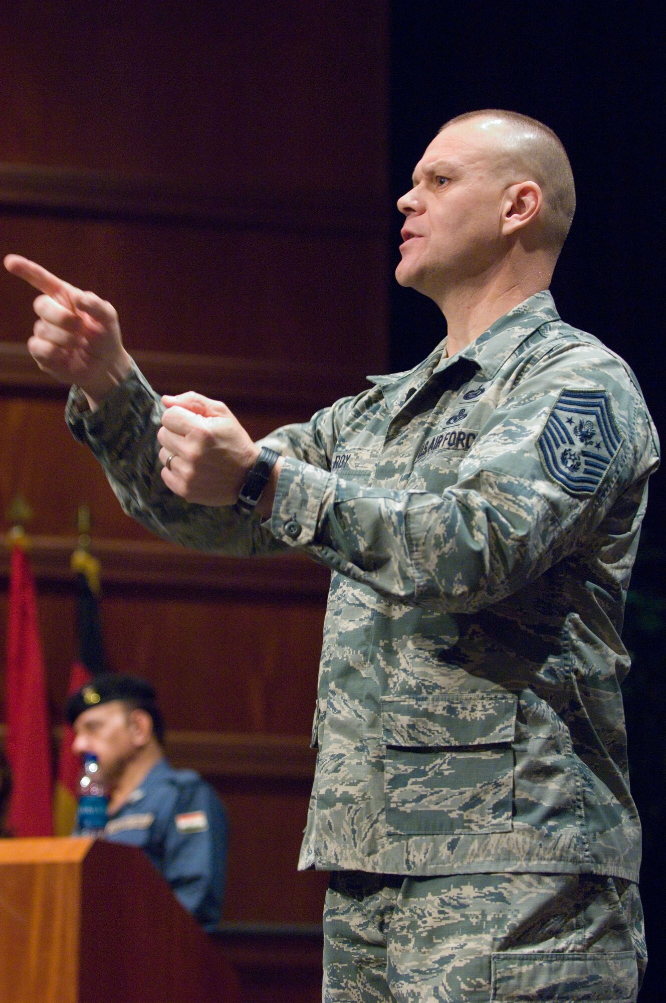 Chief Master Sgt. of the Air Force James A. Roy speaks alongside his Iraqi counterpart, the chief master sergeant of the Iraqi air force, during a session Dec. 7, 2010, at the U.S. Air Force's senior NCO academy at Maxwell Air Force Base, Ala. The Iraqi chief was in the U.S. for the first time, and visited Air University and other Air Education and Training Command bases to observe and glean ideas concerning how U.S. Air Force officials educate and train their Airmen throughout their careers. (U.S. Air Force photo/Melanie Rodgers Cox)