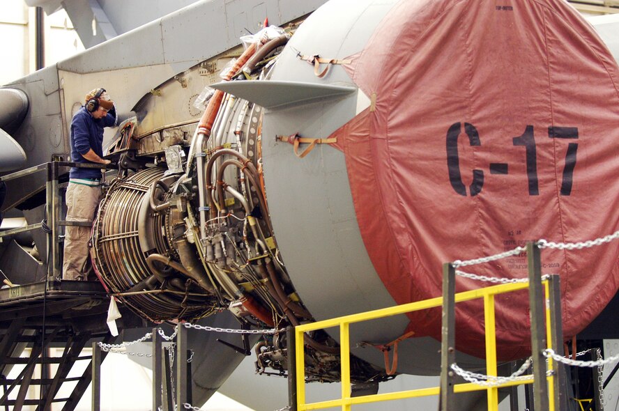 Daniel Faulk works on a C-17 pylon modification. U. S. Air Force photo by Sue Sapp