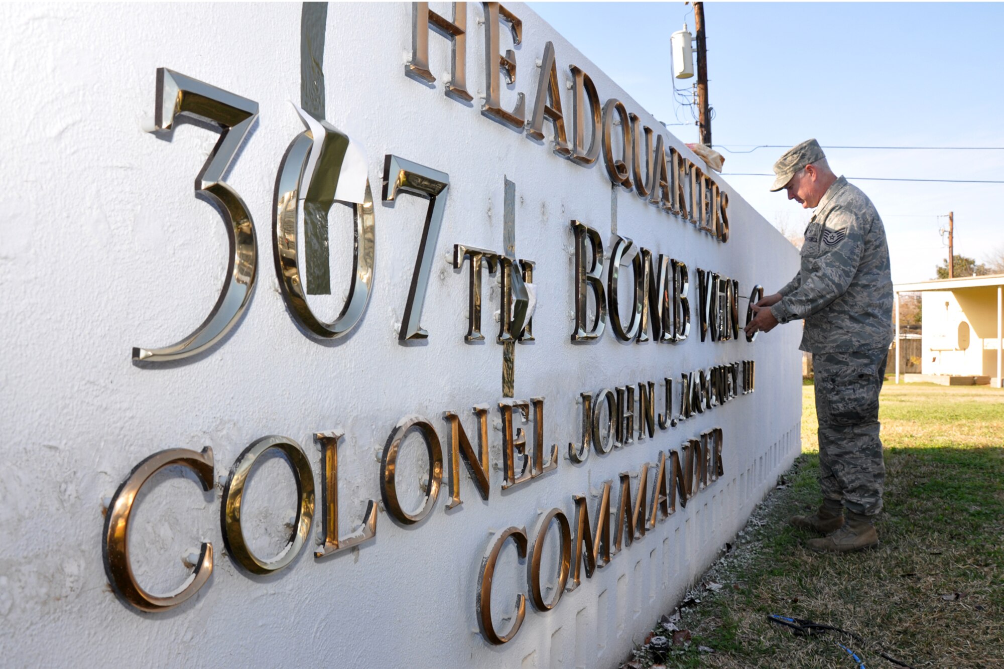 Technical Sgt. Roy E. Stockinger Jr., a structural carpenter assigned to the 917th Civil Engineer Squadron places the last “new” letter into the 917th Wing Headquarters sign at Barksdale Air Force Base, La., Dec. 7, 2010. The new letters are being placed in the sign ahead of changes coming to the Reserve Wing at Barksdale. The 917th Wing will be deactivated, and the 307th Bomb Wing reactivated in ceremonies at Hoban Hall on Barksdale AFB, Jan. 8, 2011. In addition to those changes, the 47th Fighter Squadron will be re-designated as the 917th Fighter Group in the same ceremonies. Although the equipment and personnel assigned to the 917 FG will remain at Barksdale, command and control for the unit will fall under the 442nd Fighter Wing at Whiteman Air Force Base, Mo. (U.S. Air Force photo /Tech. Sgt. Jeff Walston)