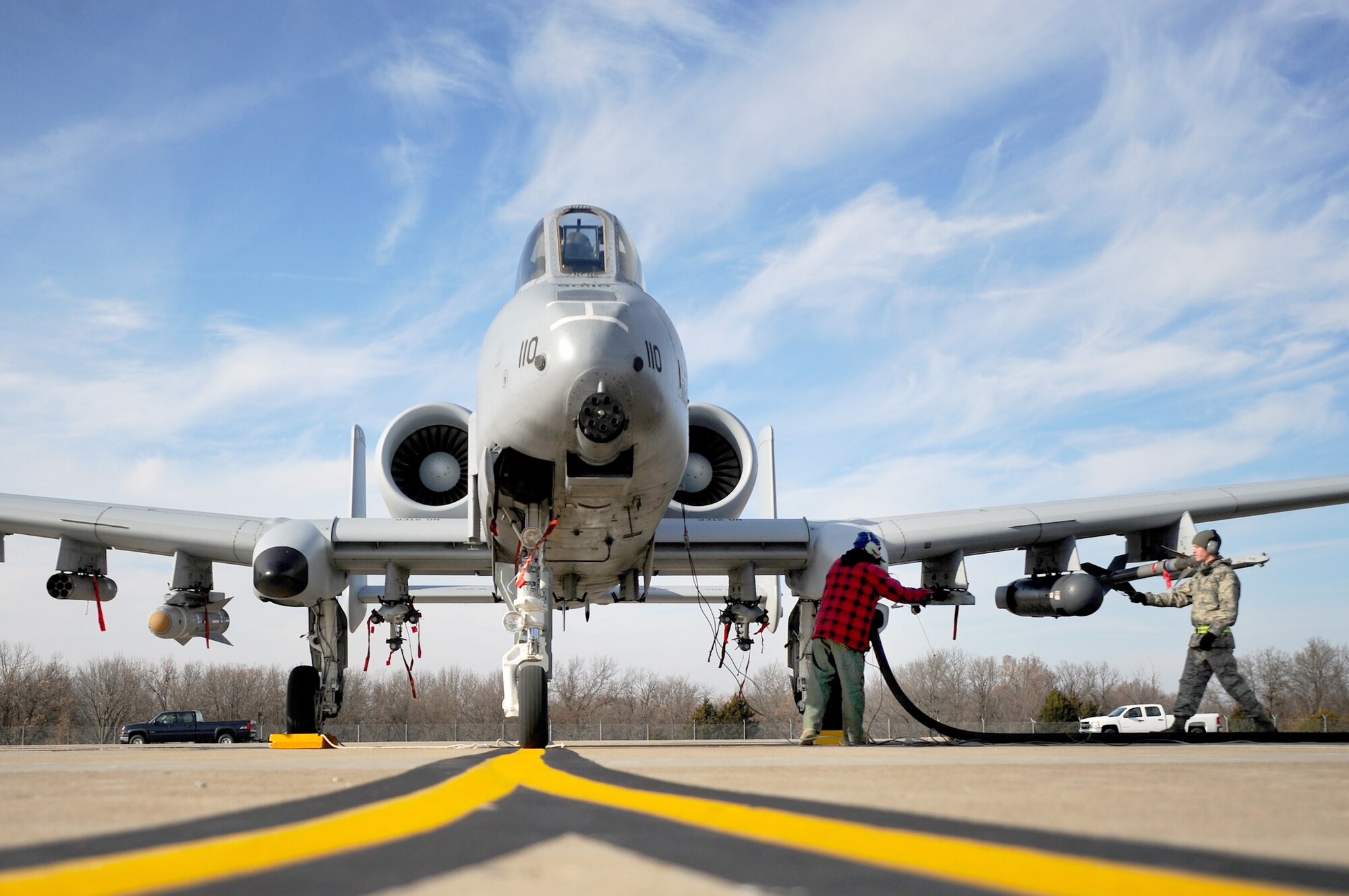 Dewayne Magnuson and Senior Airman James White work together to perform a hot pit refuel on an A-10 Thunderbolt II Dec. 8, 2010, at Whiteman Air Force Base, Mo.  The Air Force Reserve Command's 442nd Fighter Wing crews are practicing this procedure to keep their skills sharp. Mr Magnuson is an air reserve technician with the 442nd FW and Airman White is a fuels operator with the 509th Logistics Readiness Squadron. (U.S. Air Force photo/Senior Airman Kenny Holston)