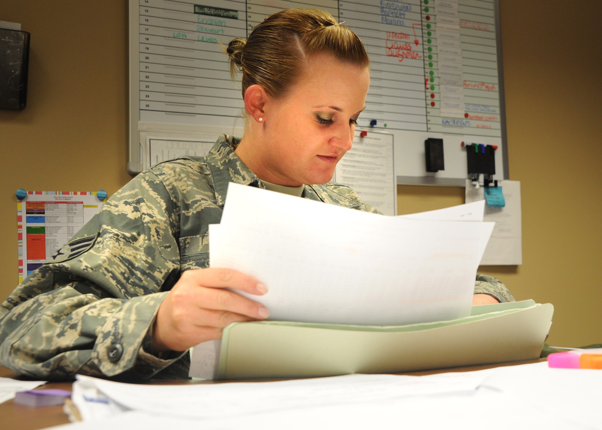 Senior Airman Rachel White, 22nd Operations Support Squadron aviation resource management journeyman, reviews aircrew medical and flight records, Dec. 7, 2010, McConnell Air Force Base, Kan. Airmen working in the Host Aviation Resource Management office ensure that all aircrew records such as flight pay, flight hours and physical training are current and accurate for pilots to operate aircraft. The HARM section processes anywhere from 10 to 20 crew members weekly.  (U.S. Air Force photo/Airman 1st Class Andrea Salazar)