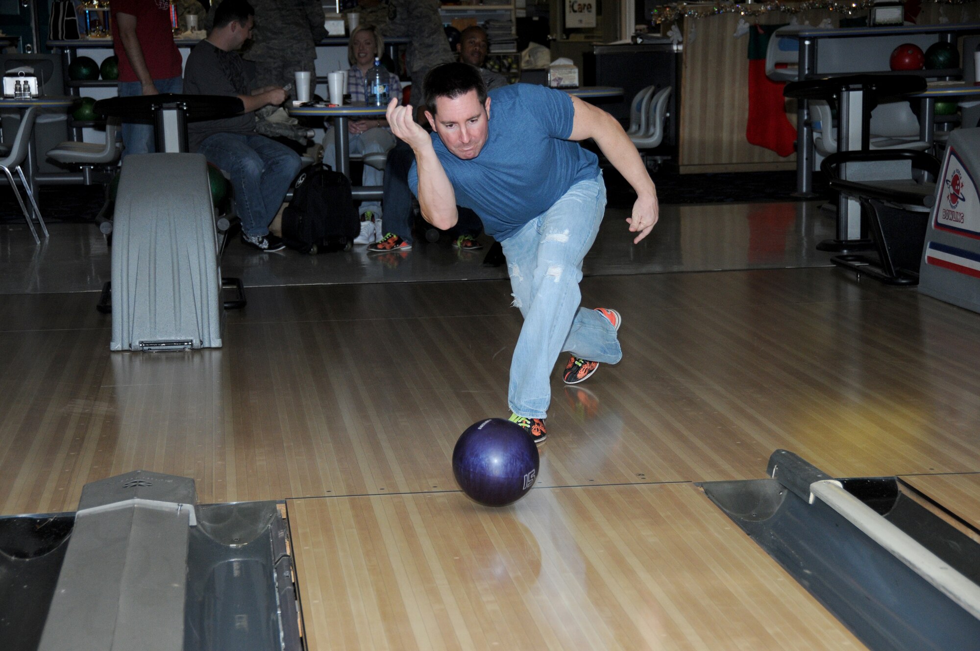 Brian Herre, 336th Training squadron, was one of the bowlers who participated in a
bowl-a-rama Friday at Gaudé Lanes to benefit Project Cheer.  The event, sponsored by the Keesler First Sergeants, helps Project Cheer provide the food for a holiday meal for junior enlisted members who need assistance during the holiday season. In addition to the entry fee, bowlers were asked to donate a non-perishable food item to be given to Airman’s Attic. The bowl-a-rama netted $200 and 60 food items.  (U.S. Air Foce photo by Kemberly Groue)
