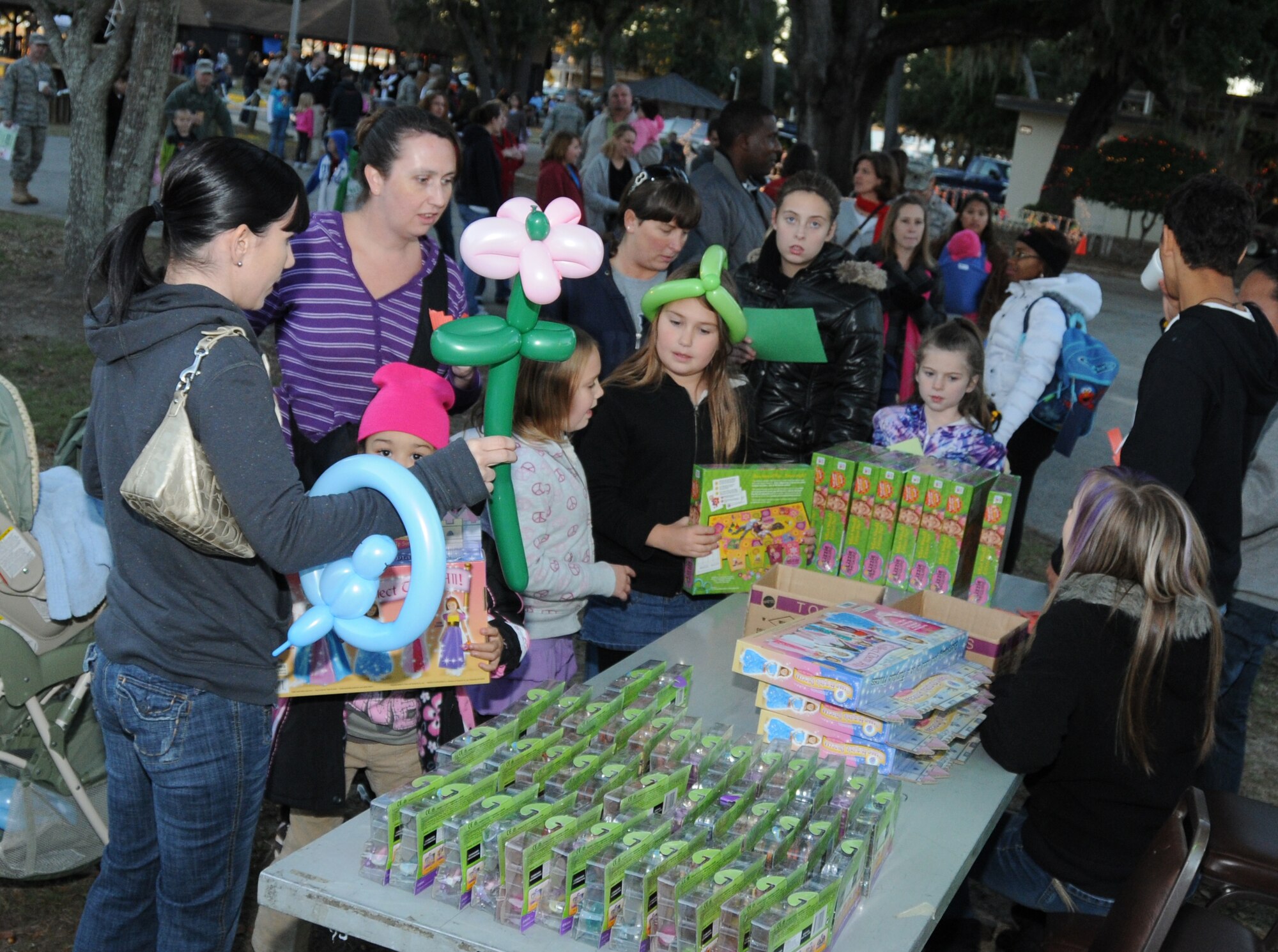 Parents escort their children to the free toy table.  (U.S. Air Force photo by Kemberly Groue)