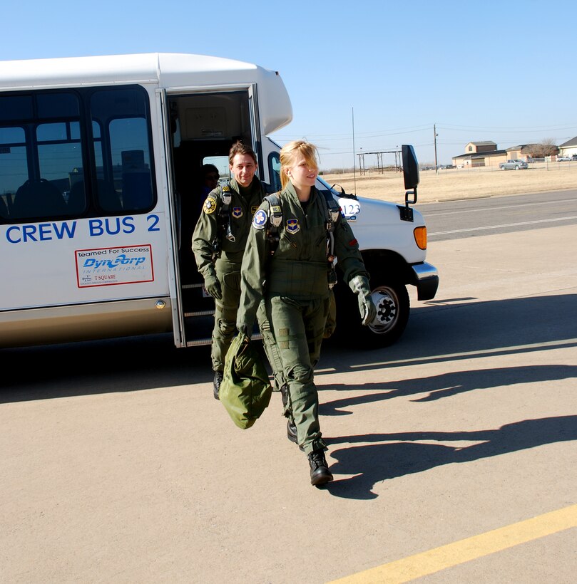 Marieke van Gaalen, front, and Royal Netherlands air force Capt. Ronald van Steijn walk out to a T-38C Talon Dec. 8 for a flight over North Texas and Southern Oklahoma. Ms. van Gaalen was awarded the flight from the Air Force ROTC detachment at the University of North Texas in Denton after she amassed the most points for recruiting efforts. She is a student of international studies at Midwestern State University in Wichita Falls, Texas. (U.S. Air Force photo/John Ingle)
