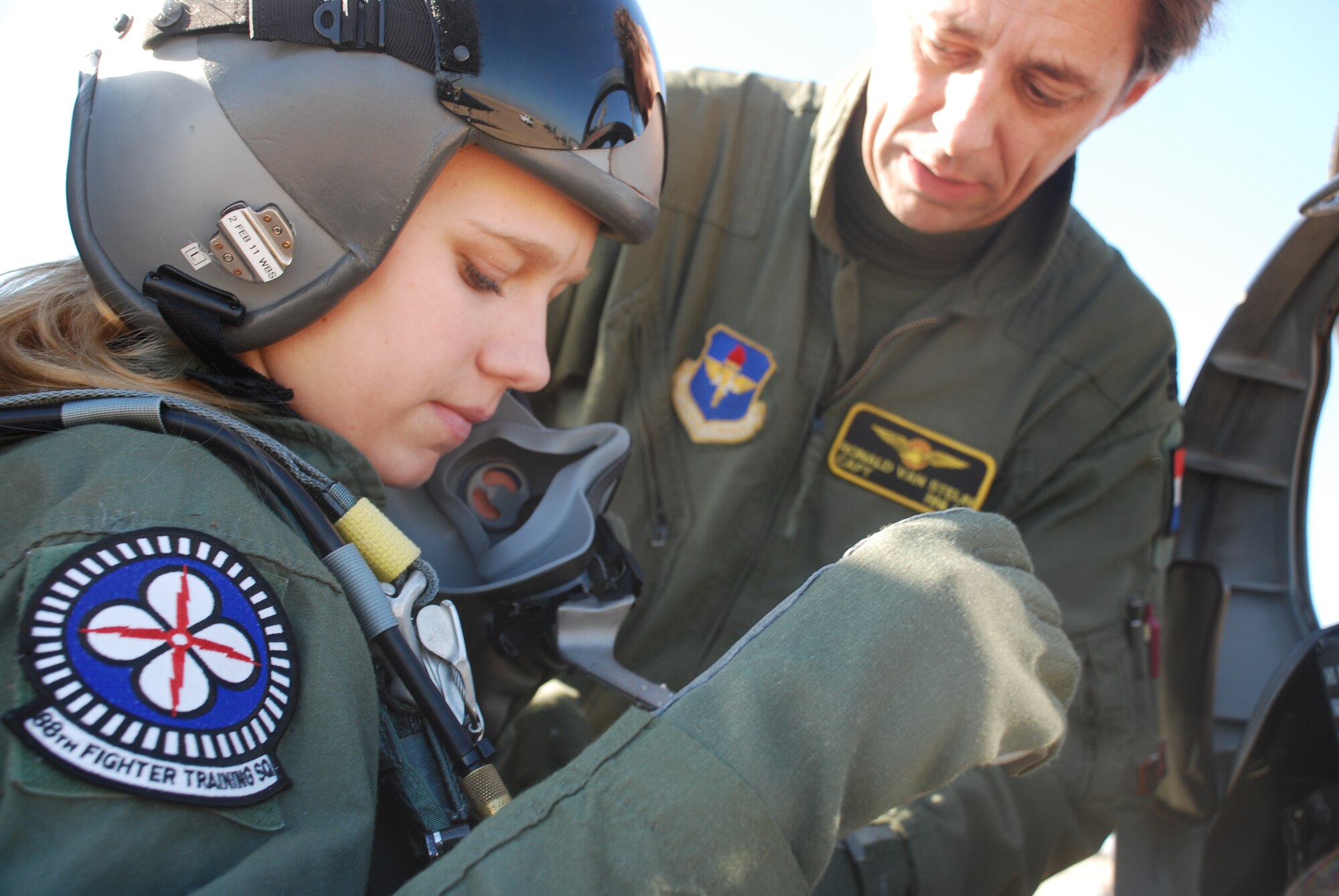Royal Netherlands air force Capt. Ronald van Steijn, right, helps secure Marieke van Gaalen in a T-38C Talon Dec. 8 prior to a flight. Ms. van Gaalen, a Dutch citizen participating in the Air Force ROTC program at the University of North Texas in Denton, received the honor to fly with the 88th Fighter Training Squadron after she accumulated the most recruiting points at the detachment. She is a student of international studies at Midwestern State University in Wichita Falls, Texas. She and other cadets travel once a week to UNT to attend ROTC events. (U.S. Air Force photo/John Ingle)