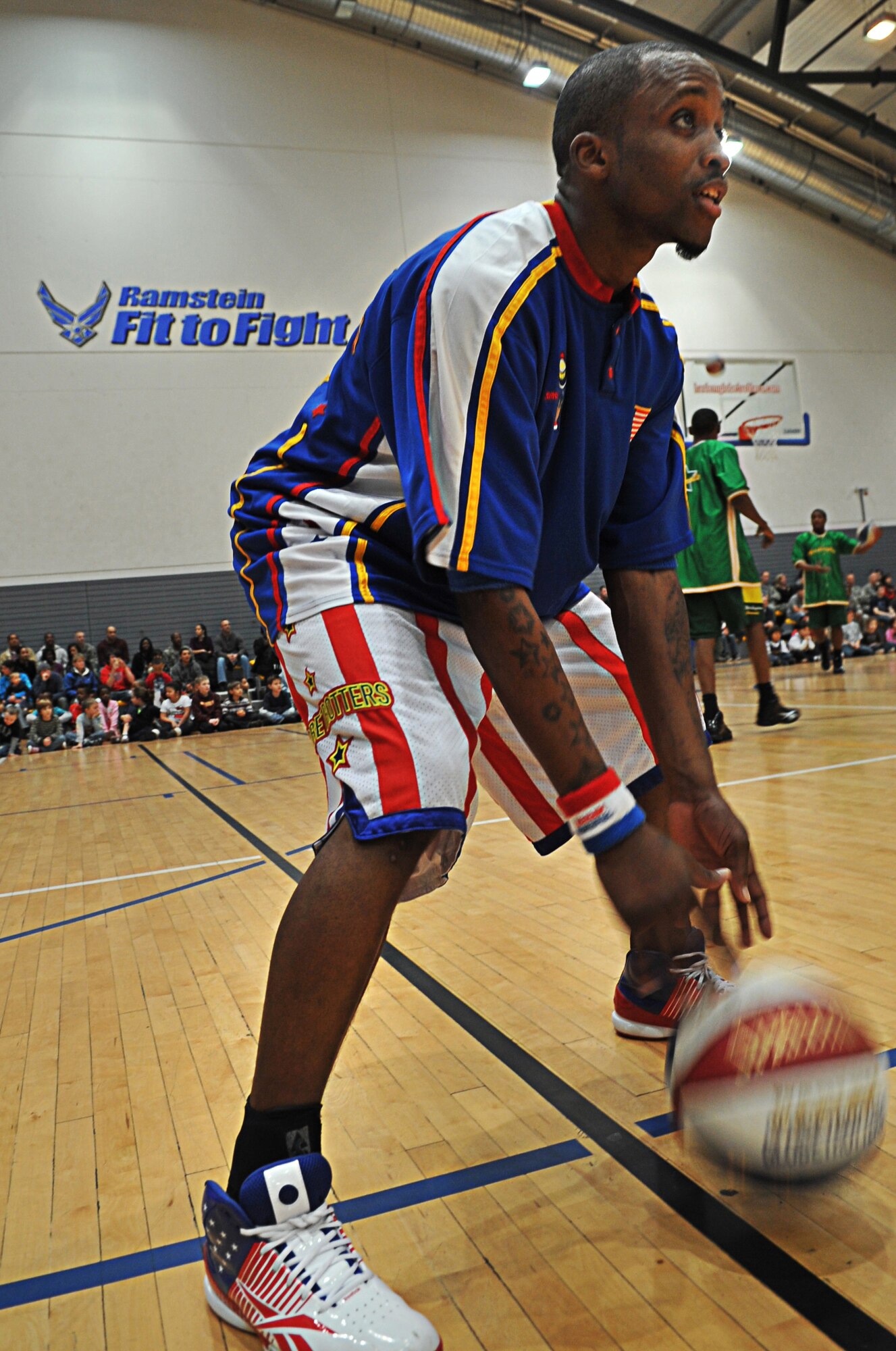 The Harlem Globetrotters performed for military members and their families during their ninth Military Holiday tour, Ramstein Air Base, Germany, Dec. 8, 2010. This tour was made possible by Navy Entertainment and Armed Forces Entertainment; this year's tour will feature 11 games on U.S. military bases in five countries: Germany, Italy, Greece, the Netherlands and the United Kingdom. The Globetrotters are celebrating their 85th year entertaining audiences around the world. (U.S. Air Force photo by Airman 1st Class Desiree Esposito)