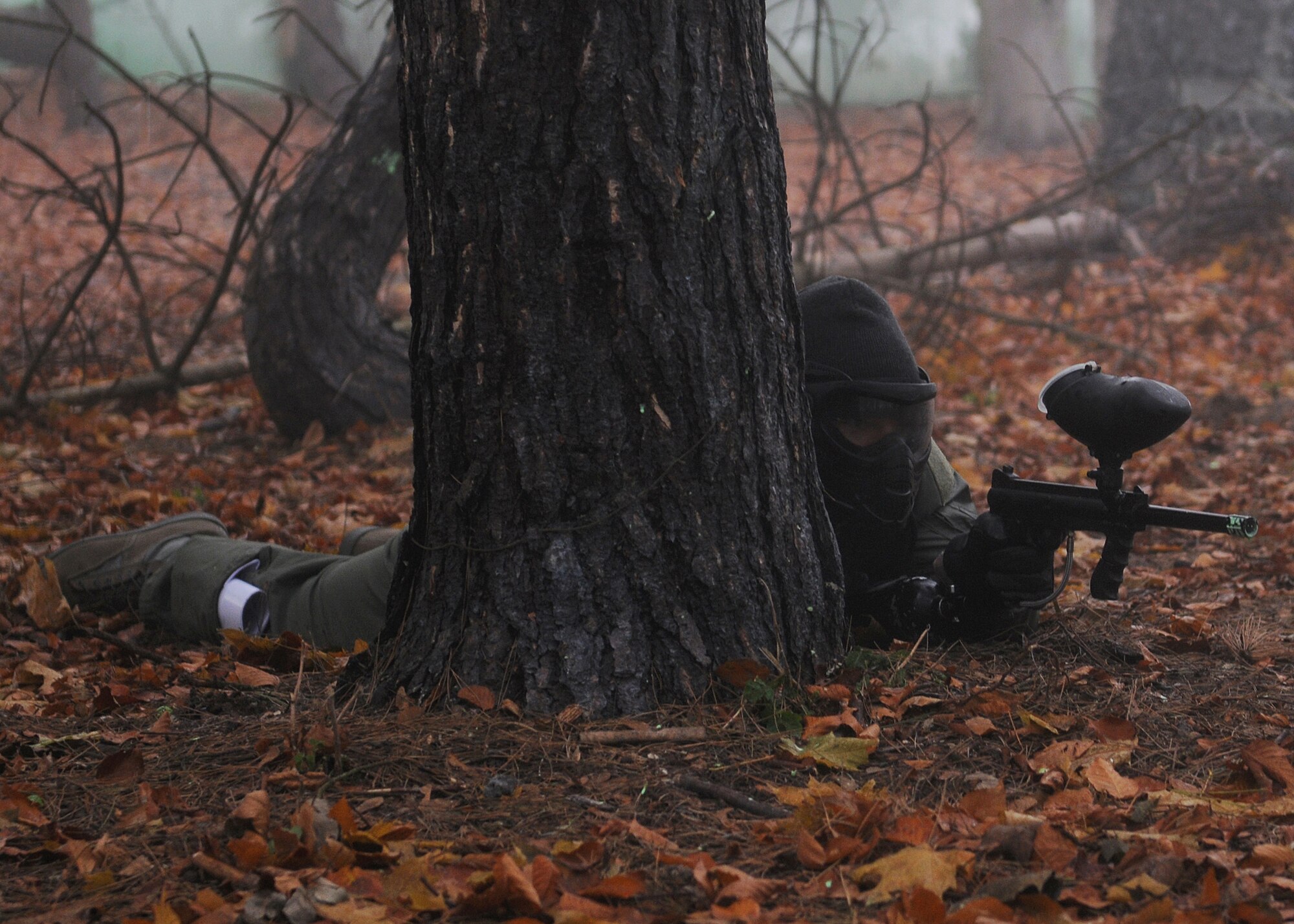 RAF MARHAM, England -- Capt. Alex Waxman, 351st Air Refueling Squadron, plays paintball during Leader, Ethos and Air Power Training Day here Dec. 6, 2010. This activity demanded the team members work together to capture the flag of the opposing team through planning, communication and physical stamina. (U.S. Air Force photo/Senior Airman Tabitha M. Lee) 
