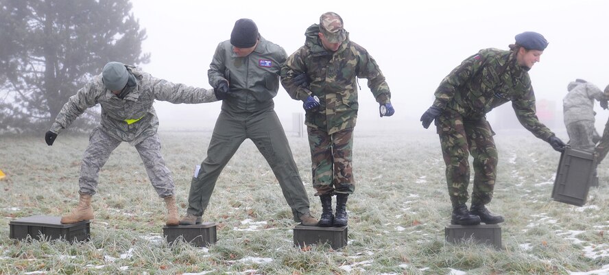 RAF MARHAM, England -- U.S. and British Airmen from RAFs Mildenhall and Marham participate in a team building exercise during Leader, Ethos and Air Power Training Day here Dec. 6, 2010. LEAP was achieved in a safe training environment, allowing participants to show individual character, spirit and attitude while facing physical and mental challenges. (U.S. Air Force photo/Senior Airman Tabitha M. Lee)