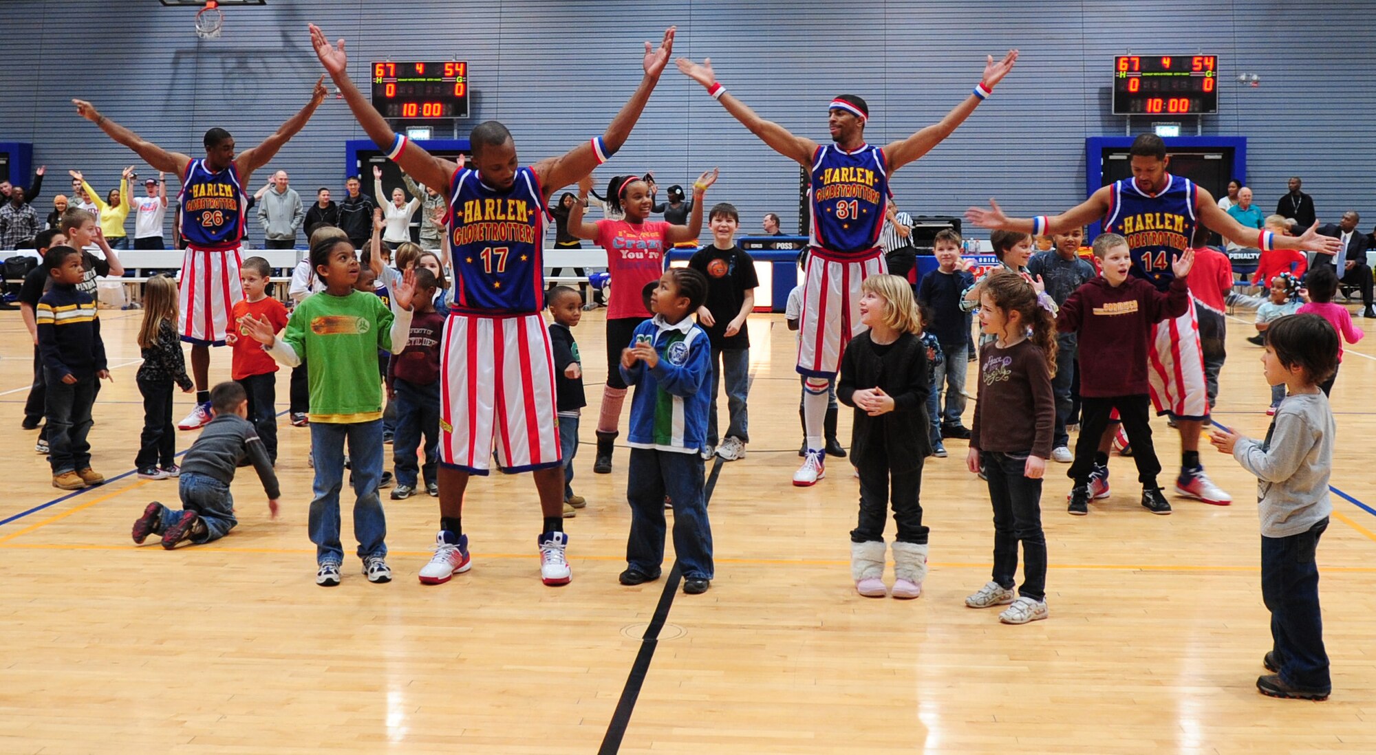 The Harlem Globetrotters performed for military members and their families during their ninth Military Holiday tour, Ramstein Air Base, Germany, Dec. 8, 2010. This tour was made possible by Navy Entertainment and Armed Forces Entertainment; this year's tour will feature 11 games on U.S. military bases in five countries: Germany, Italy, Greece, the Netherlands and the United Kingdom.  The Globetrotters are celebrating their 85th year entertaining audiences around the world. (U.S. Air Force photo by Senior Airman Brittany Nicole Perry)