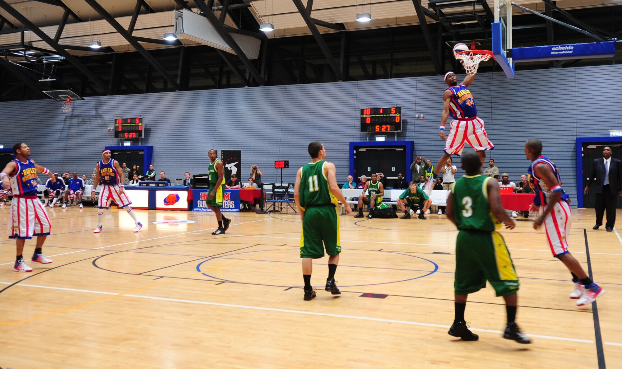 The Harlem Globetrotters play against the Washington Generals during their ninth Military Holiday tour, Ramstein Air Base, Germany, Dec. 8, 2010. This tour was made possible by Navy Entertainment and Armed Forces Entertainment; this year's tour will feature 11 games on U.S. military bases in five countries: Germany, Italy, Greece, the Netherlands and the United Kingdom.  The Globetrotters are celebrating their 85th year entertaining audiences around the world. (U.S. Air Force photo by Senior Airman Brittany Nicole Perry)