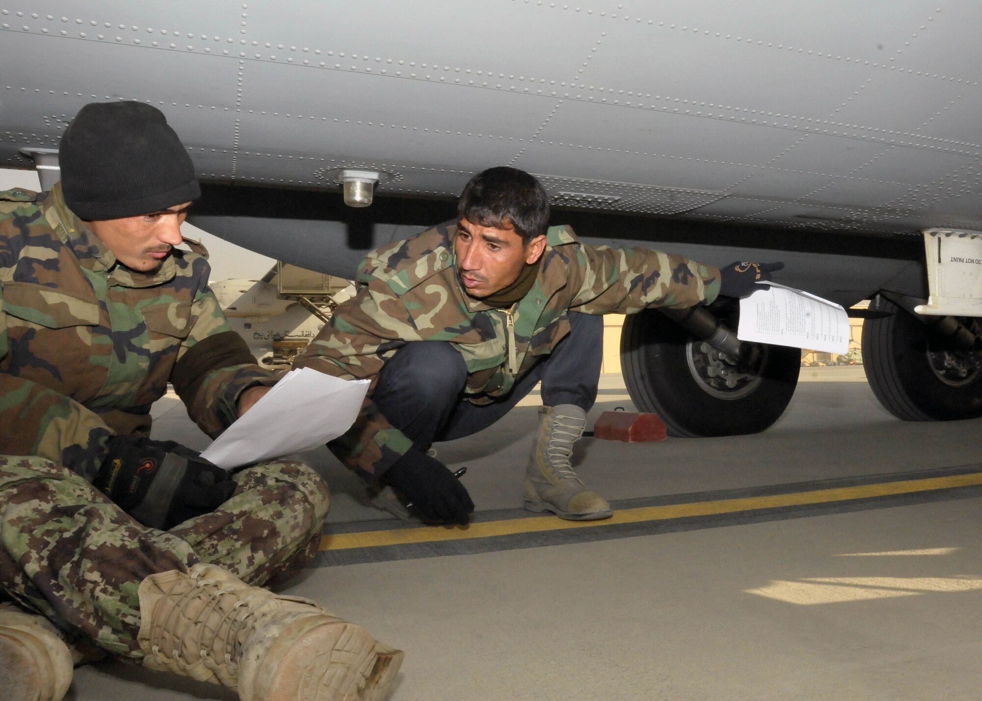 101208-N-6541W-022 KABUL, Afghanistan - Afghan Air Force C-27 Spartan maintainers inspect, service and launch a C-27 without advisor or contractor assistance at the Afghan Air Force Base on the Kabul International Airport, on Dec.  (U.S. Navy photo by Mass Communication Specialist 3rd Class Jared Walker/ RELEASED).