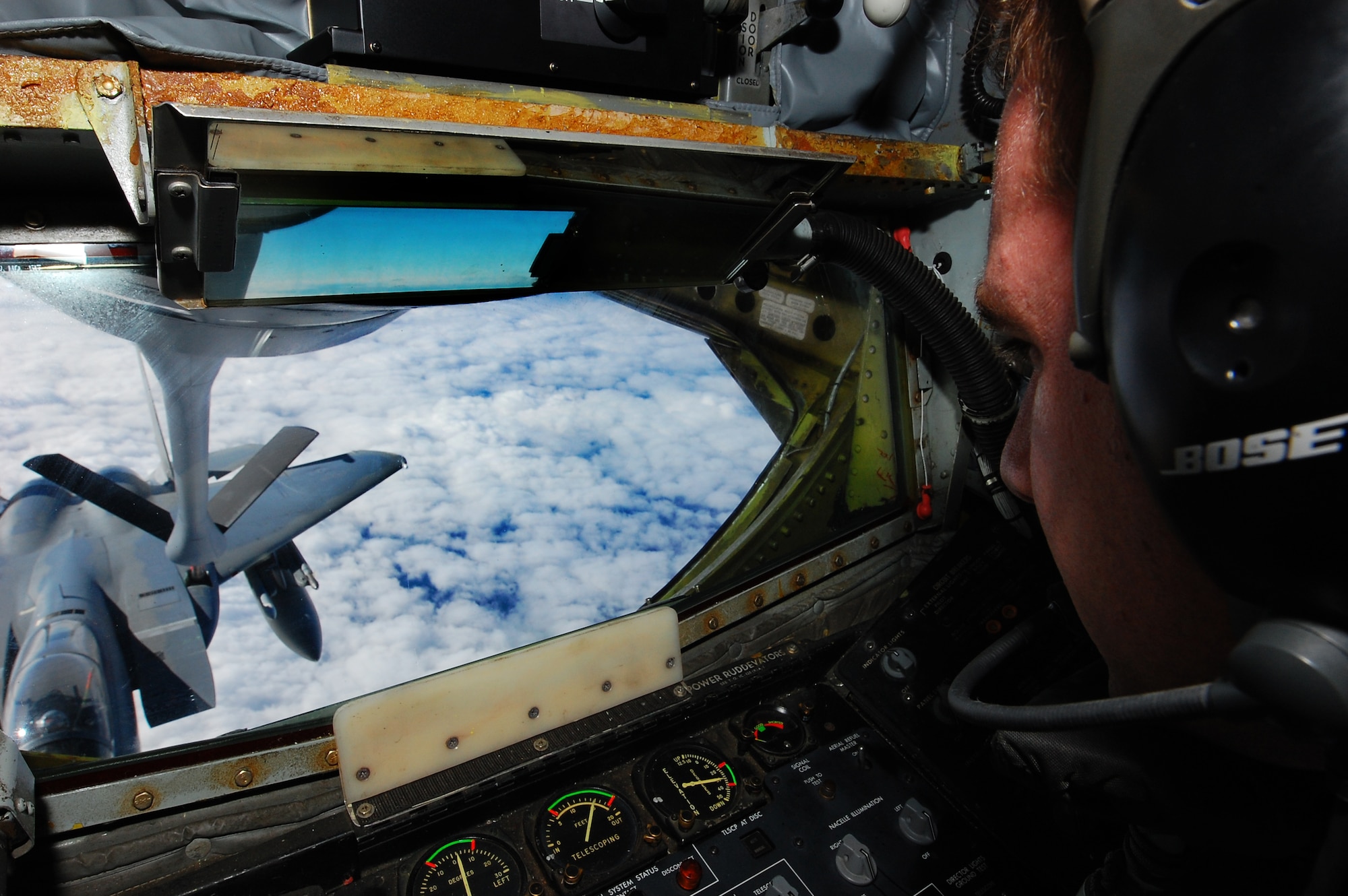 Technical Sgt. Jess Cox, a boom operator with the 185th Air Refueling Squadron, Oklahoma Air National Guard, Tinker AFB, controls the boom as an F-15 from the 67th Fighter Squadron during the Keen Sword exercise here at Kadena Air Base, Japan, Dec. 8 During Keen Sword 2011, units from the United States Army, Navy, Air Force and Marine Corps, will conduct training with their Japan Self-Defense Force counterparts at military installations throughout mainland Japan, Okinawa and in the waters surrounding Japan. ( U.S. Air Force photo/ Staff Sgt Lakisha A. Croley)