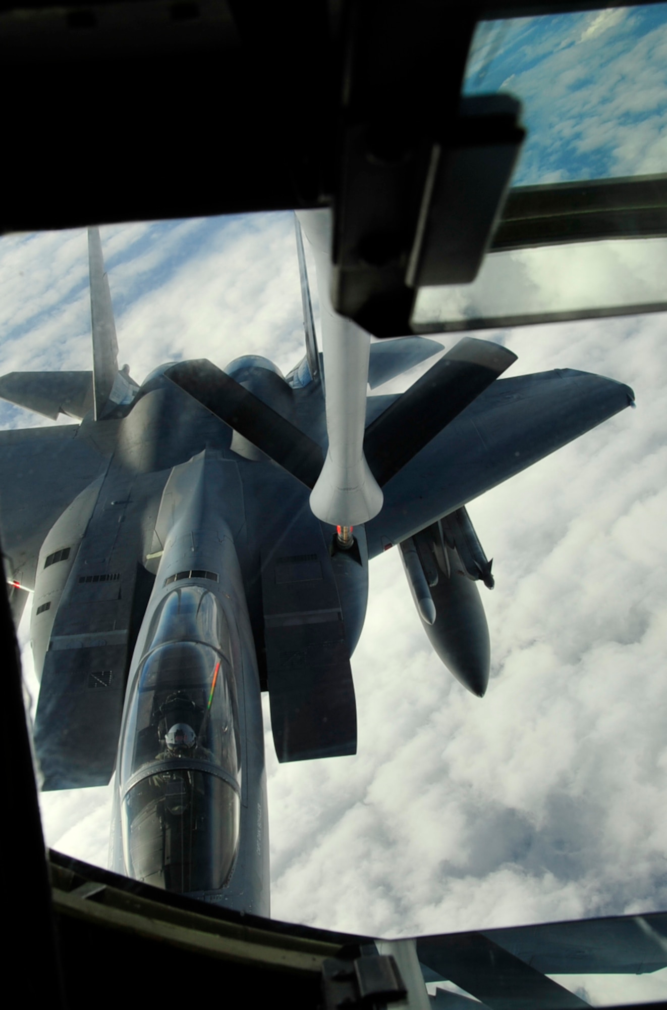 An F-15 with the 67th fighter squadron gets refueled during the Keen Sword exercise here at Kadena Air Base, Japan, Dec. 8. Keen Sword is designed to allow the United States and Japan to practice and evaluate the coordination procedures and interoperability elements required to effectively and mutually respond to the defense of Japan, or to a regional crisis or contingency situation in the Asia-Pacific region, while building bilateral confidences and working relationships. ( U.S. Air Force photo/ Staff Sgt. Lakisha A.Croley)