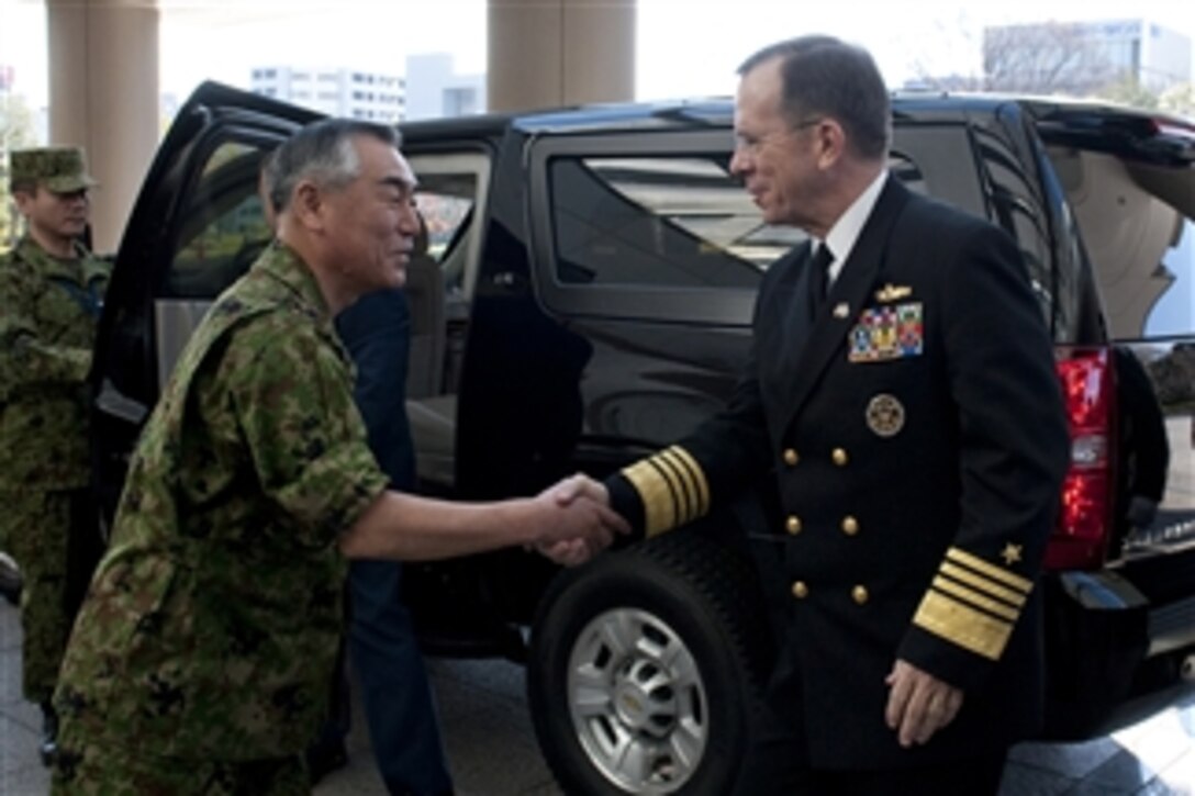 Chairman of Japan's Joint Chiefs of Staff Gen. Ryoichi Oriki greets Chairman of the Joint Chiefs of Staff Adm. Mike Mullen in Tokyo, Japan, on Dec. 9, 2010.  Mullen traveled to Japan to meet with defense officials there reassuring the strength of the U.S.-South Korean alliance amid escalating tensions on the Korean Peninsula.  