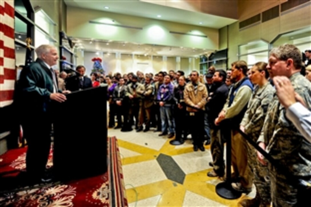 U.S. Defense Secretary Robert M. Gates talks to workers during a town hall meeting at the U.S. Embassy in Kabul, Afghanistan, Dec. 9, 2010. Gates thanked the embassy workers and awarded a Bronze Star Medal during his visit.