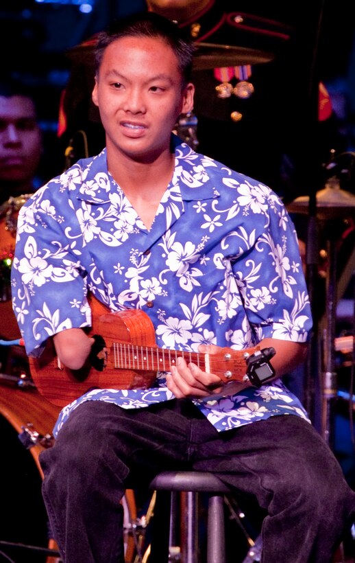 Nick Acosta, a young and talented ukulele player who was born without a right forearm, performs Dec. 10 during the third annual Na Mele o na Keiki (Music for the Children) Holiday Concert at the Neal S. Blaisdell Concert Hall here. In addition to spreading holiday cheer and showing support for the community, members of the Marine Corps Reserve’s Toys for Tots Program were on hand to accept donations for children in need living in Hawaii.