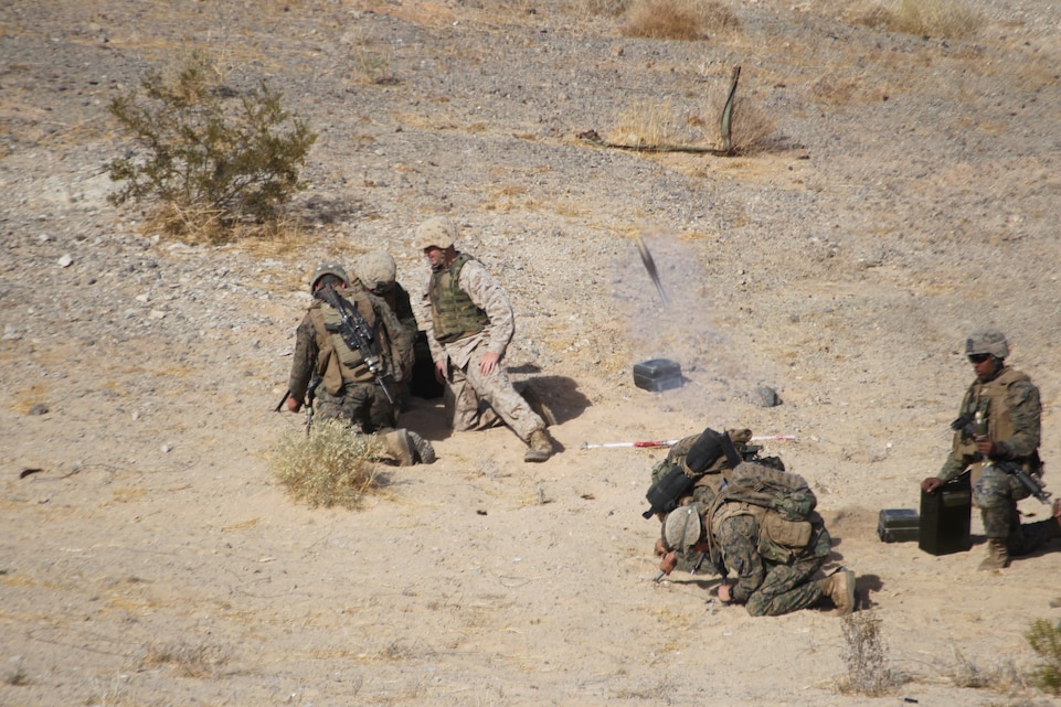 Students with the Infantry Officer Course, based out of Marine Corps Base Quantico, Va., fire off a 60mm mortar Dec. 10, 2010, during one of their platoon-sized mechanized attacks aboard the Combat Center. The IOC culminates its training by operating at the Combat Center before graduating back in Quantico.