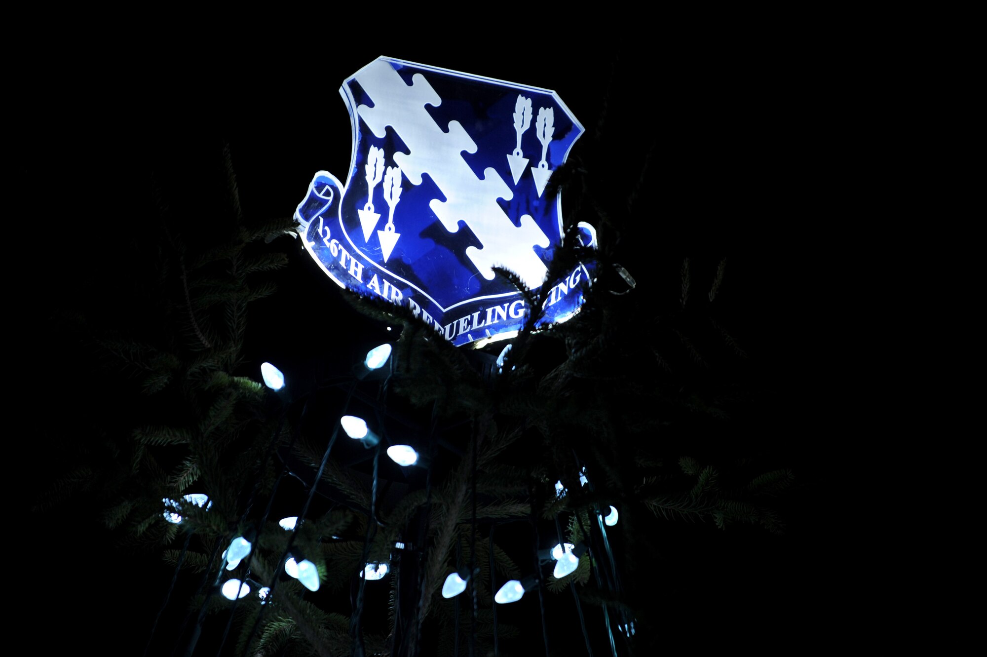The 126th Air Refueling Wing, Illinois Air National Guard highlights their Christmas tree with their patch. Members of team Scott decorated around the base to show their holiday spirit. (U.S. Air Force photo by Staff Sgt. Brian J. Valencia)