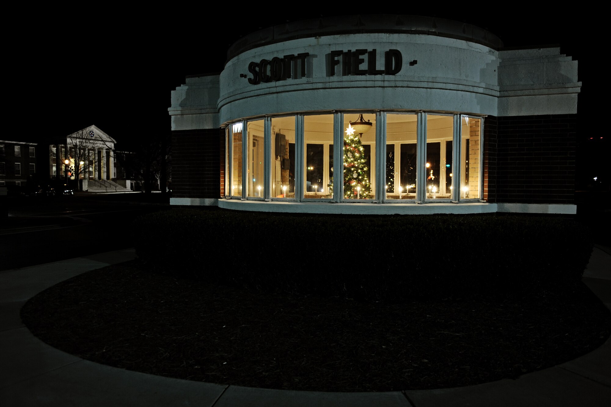 A Christmas tree and lights brighten up the old Scott Field gate for the holiday season, Dec. 10, 2010. Members of team Scott decorated around the base to show their holiday spirit. (U.S. Air Force photo by Staff Sgt. Brian J. Valencia)