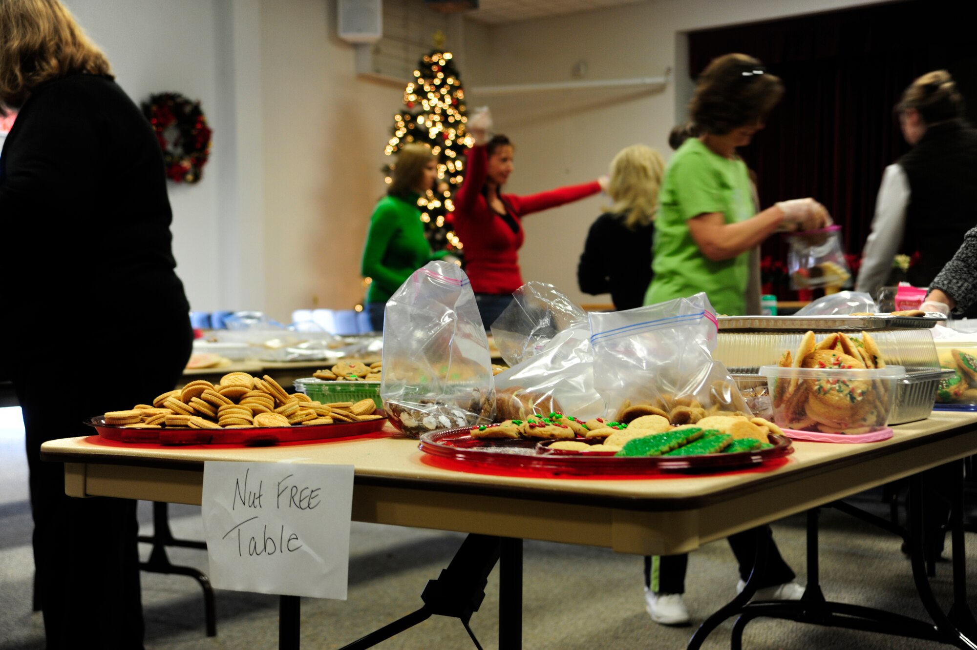 Cookies and other tasty holiday treats are sorted out and packaged Dec. 10 during the annual McChord cookie drop, hosted by the Chapel Support Center at McChord Field, Joint Base Lewis-McChord, Wash. The treats will be distributed by squadron first sergeants to Airmen living in the dorms. (U.S. Air Force photo/Adamarie Lewis-Page)