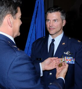 Randolph AFB, TX, date shot:  20101010 (U.S. Air Force photo/ By Don Lindsey Major General Frank Padilla Commander, Tenth Air Force Air Force Reverve Command Joint Reserve Base Fort Worth, Texas presents the Airman's Medal to Lt. Col Richard L. Lowe, assigned to the 39th Flying Training Squadron at a ceremony  held at Randolph AFB theater on December 10, 2010.  Lt. Col Lowe distinguished himself by heroism involving voluntary risk of life following the crash of Flight 1404 at Denver International Airport on 20 December 2008.