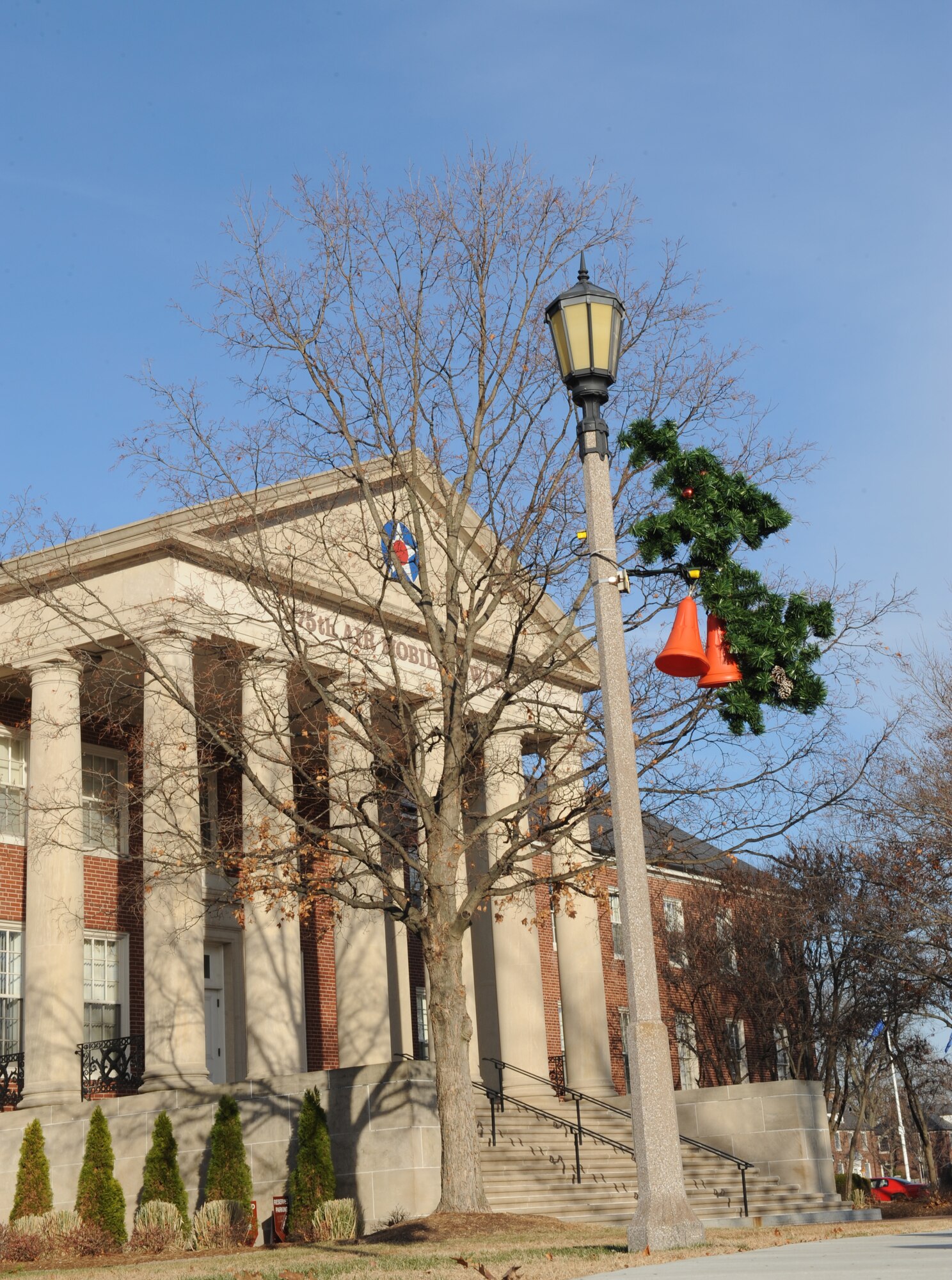 Christmas bells hang off the light post outside of the 375th Air Mobility Wing Dec. 10. Scott Air Force Base takes pride in decorating for the holiday season. (U.S. Air Force photo/ Airman 1st Class Divine Cox)