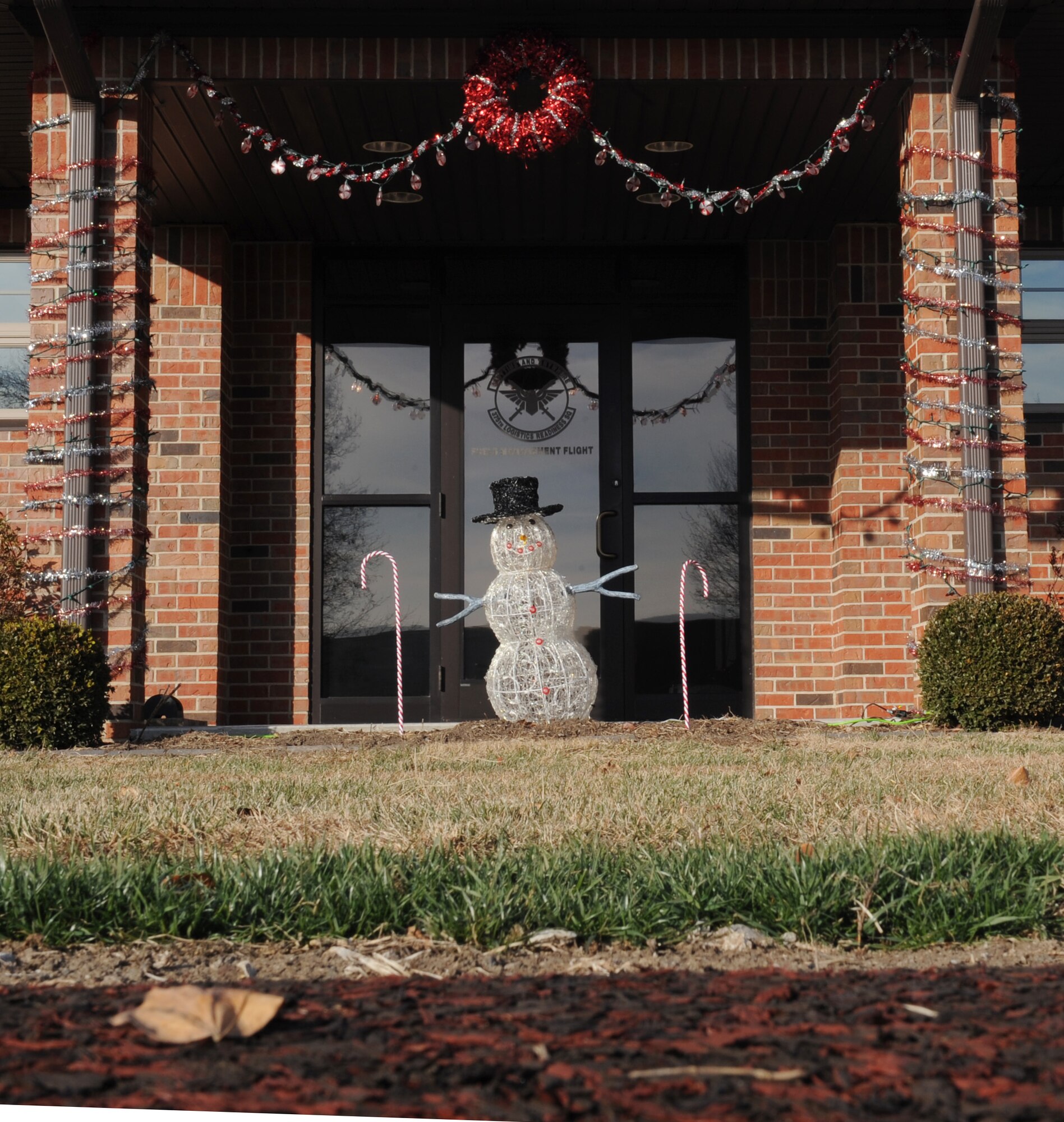 The 375th Logistics Readiness Squadron Petroleum’s, oils, and lubricants (POL) flight, shows some holiday spirit by decorating their front door Dec. 10.  Scott Air Force Base takes pride in decorating for the holiday season. (U.S. Air Force photo/ Airman 1st Class Divine Cox)