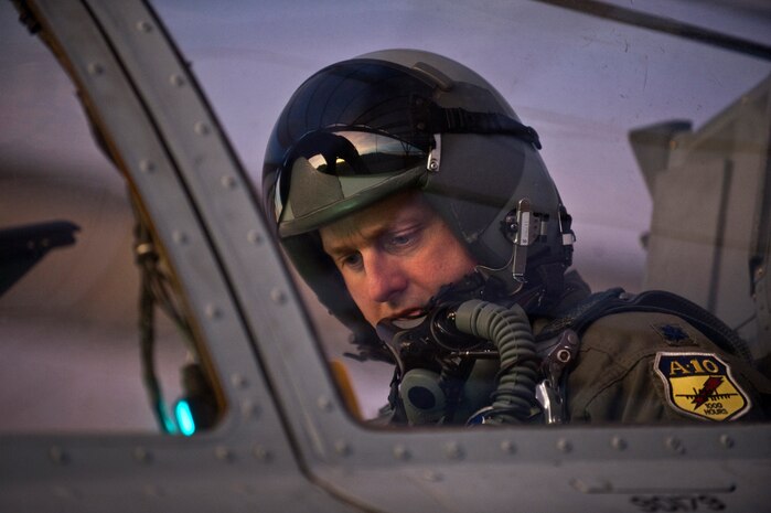 NELLIS AIR FORCE BASE, Nev. --  Lt. Col. Jim Clark, 74th Fighter Squadron, commander from Moody Air Force Base, Ga., reviews a pre-flight check list in the cockpit of an A-10 Thunderbolt II before a training mission during the Green Flag West 11-2 exercise at Nellis Dec. 10. Green Flag-West provides a realistic air-land integration training environment for forces preparing to support worldwide combat operations. (U.S. Air Force photo by Tech. Sgt. Michael R. Holzworth)