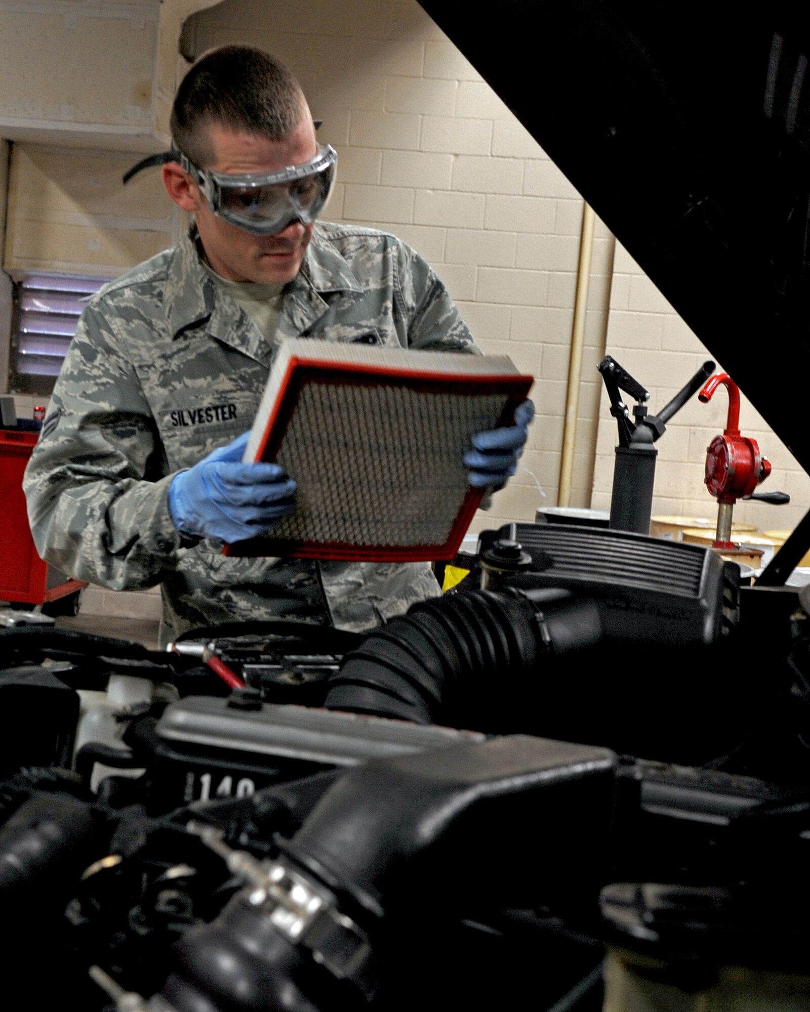 Airman 1st Class Scott Silvester, 2nd Logistic Readiness Squadron vehicle and equipment maintenance apprentice, removes the filter from a Dodge Bobtail during an overall inspection on Barksdale Air Force Base, La., Dec. 10. An overall inspection consists of fluid checks, hoses, corrosion and visual. The 2 LRS vehicle maintenance facility is responsible for more than 800 of Barksdale's government vehicles. (U.S. Air Force Photo/Senior Airman La'Shanette V. Garrett)(RELEASED)