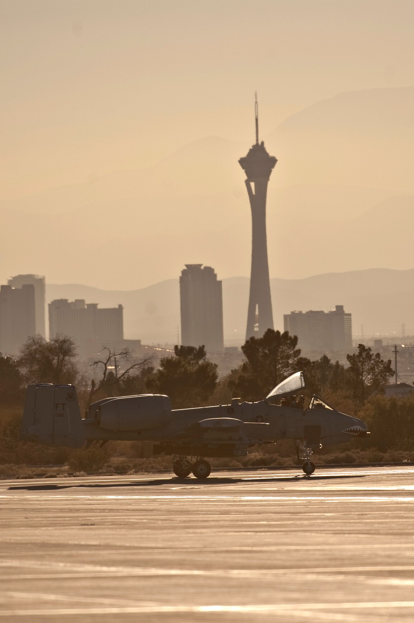 NELLIS AIR FORCE BASE, Nev. -- An A-10 Thunderbolt II from the 74th Fighter Squadron, Moody Air Force Base, Ga., taxi's toward the end on the Nellis runway for a training mission during the Green Flag West 11-2 exercise at Nellis Dec. 6. Green Flag-West provides a realistic air-land integration training environment for forces preparing to support worldwide combat operations. (U.S. Air Force photo by Tech. Sgt. Michael R. Holzworth)
