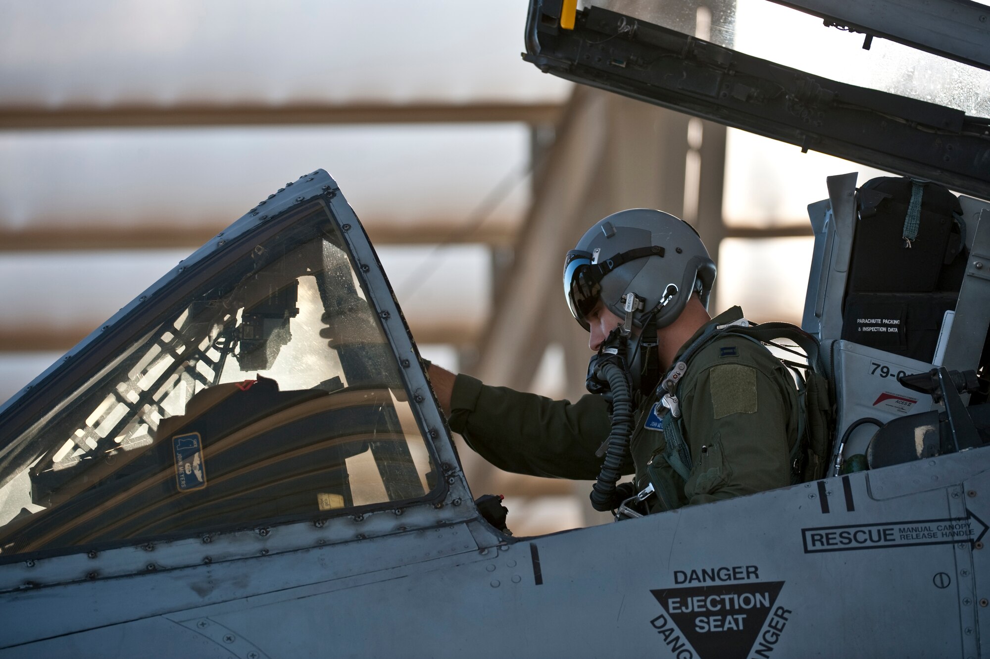 NELLIS AIR FORCE BASE, Nev. -- Capt. John Meyers of the 74th Fighter Squadron from Moody Air Force Base, Ga., conducts pre-flight checks in an A-10 Thunderbolt II before a training mission during the Green Flag West 11-2 exercise at Nellis Dec. 6. Green Flag-West provides a realistic air-land integration training environment for forces preparing to support worldwide combat operations. (U.S. Air Force photo by Tech. Sgt. Michael R. Holzworth)