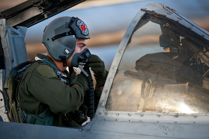 NELLIS AIR FORCE BASE, Nev. -- Capt. John Meyers of the 74th Fighter Squadron from Moody Air Force Base, Ga., conducts pre-flight checks in an A-10 Thunderbolt II before a training mission during the Green Flag West 11-2 exercise at Nellis Dec. 6. Green Flag-West provides a realistic air-land integration training environment for forces preparing to support worldwide combat operations. (U.S. Air Force photo by Tech. Sgt. Michael R. Holzworth)