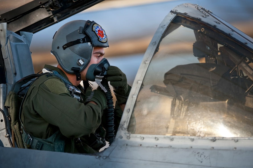 NELLIS AIR FORCE BASE, Nev. -- Capt. John Meyers of the 74th Fighter Squadron from Moody Air Force Base, Ga., conducts pre-flight checks in an A-10C Thunderbolt II before a training mission during the Green Flag West 11-2 exercise at Nellis Dec. 6. Green Flag-West provides a realistic air-land integration training environment for forces preparing to support worldwide combat operations. (U.S. Air Force photo by Tech. Sgt. Michael R. Holzworth)(RELEASED)


